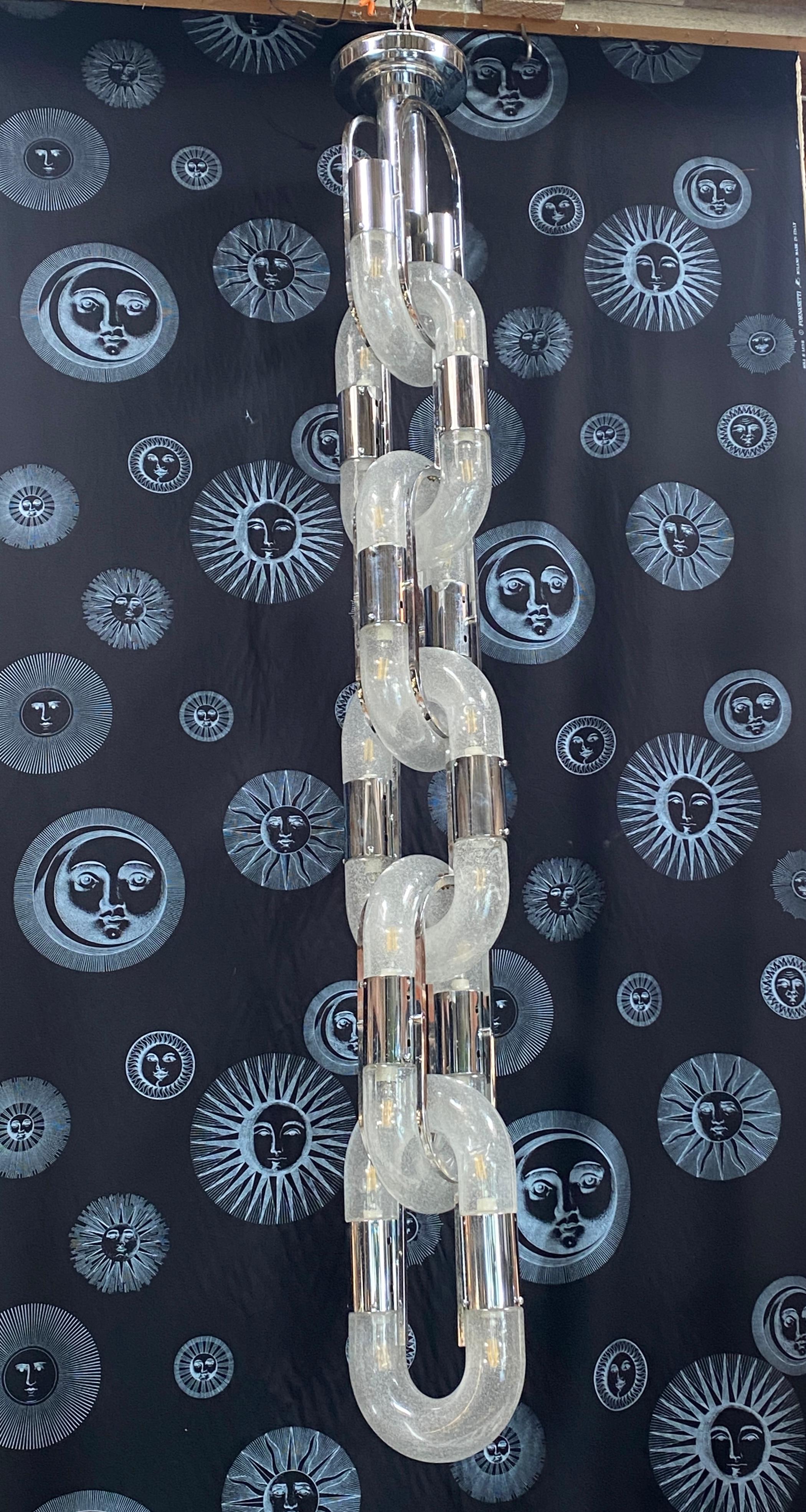 Outstanding chain chandelier ceiling pendant light lamp 6 rings by Aldo Nason for the manufacture Mazzega Murano. Blown bubble Murano glass. Famous manufacture like Venini, Vistosi, La Murrina, Seguso, Carlo Nason, Poliarte.
Nothing touches,