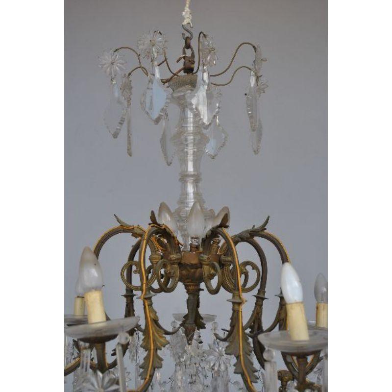 Chandelier with crystal pendants in gilded bronze in rockery style with 12 lights from the 19th century, formerly gas. Dimension height 100 cm for a diameter of 85 cm.

Additional information:
Material: Bronze, Glass & crystal.