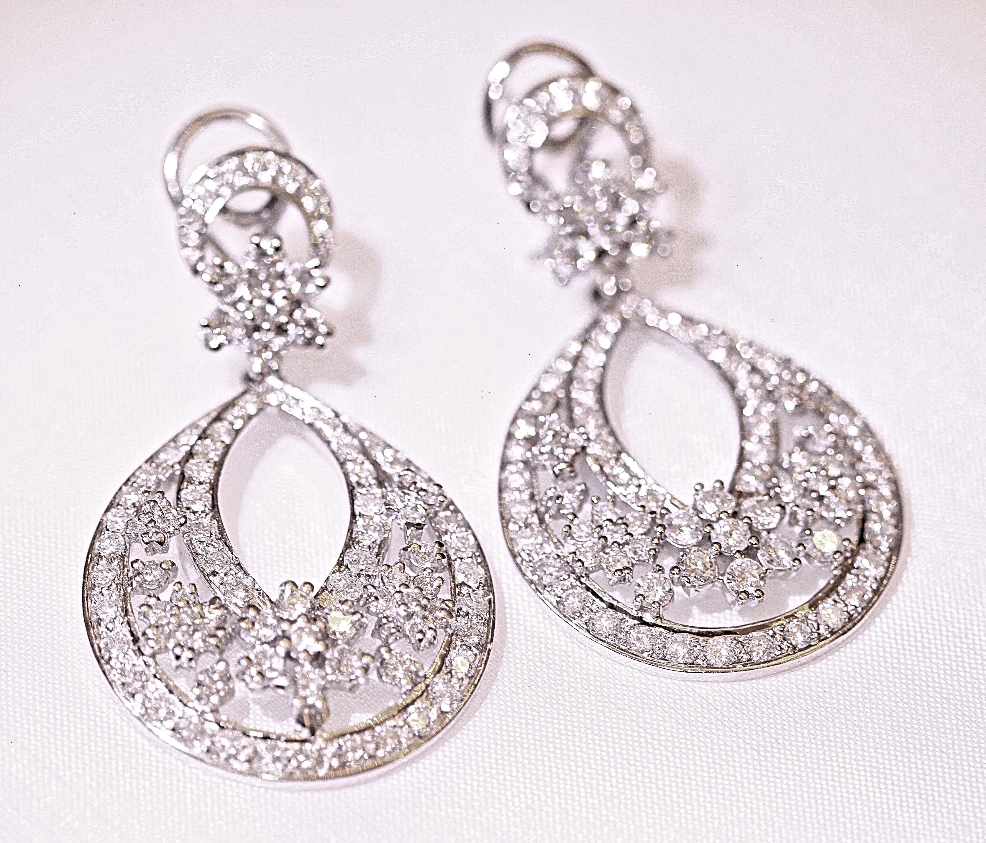 These dazzling chandelier earrings consists of an approximate 8.50 carats total weight of round brilliant cut diamonds.  The diamonds are white in color and VS-I in clarity.  The earrings measure 2 inches long and 1 1/8 inches wide.  The earrings
