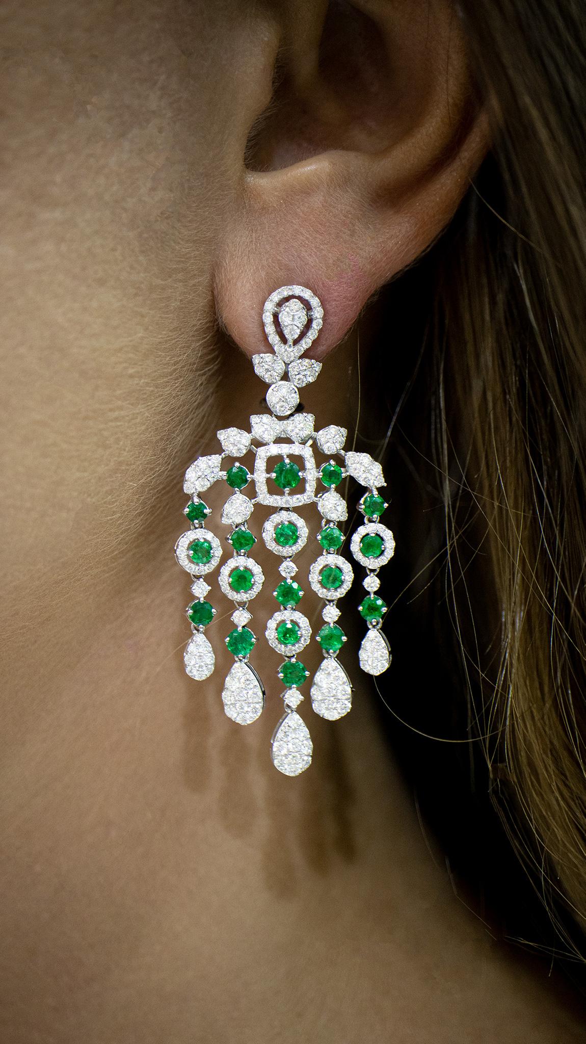 Beautiful Chandelier Earrings Set With Emeralds and Diamonds. It comes with an appraisal by GIA G.G.
Total Carat Weight of Emeralds is 3.46 Carats
Total Carat Weight of Diamonds is 3.87 Carats
Diamonds Color is F
Diamonds Clarity is VS+
Metal is 18K