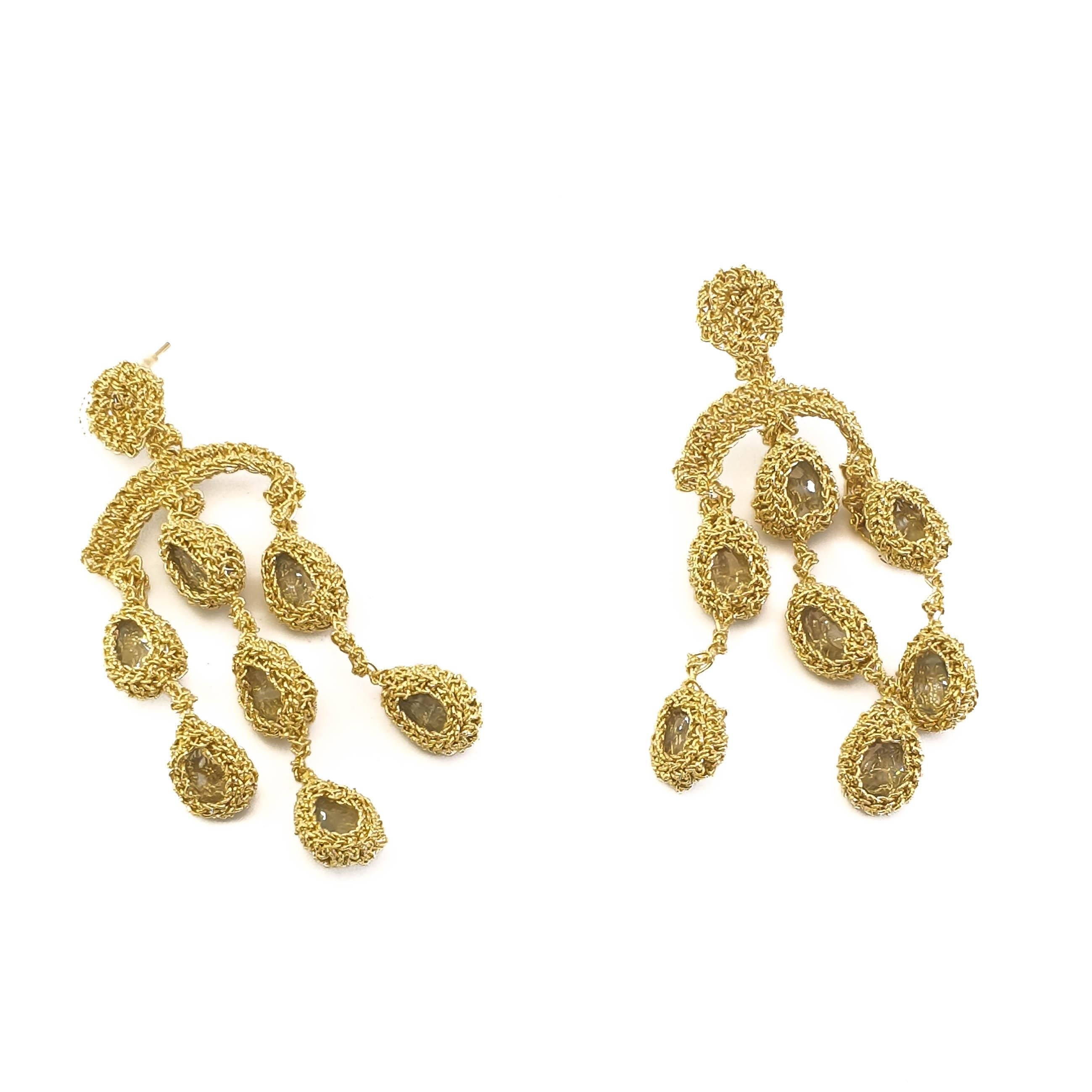 Beautifully crafted hand crochet gold thread (12.3 grams) earring with aquamarines (weighing in total 4.2 grams/21 carats. Elegant and Classic Chandelier earrings for everyday and special occasions.

Shenhav's inspiration comes from the world's