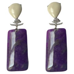 Boucles d'oreilles chandelier avec diamants et matériaux rares