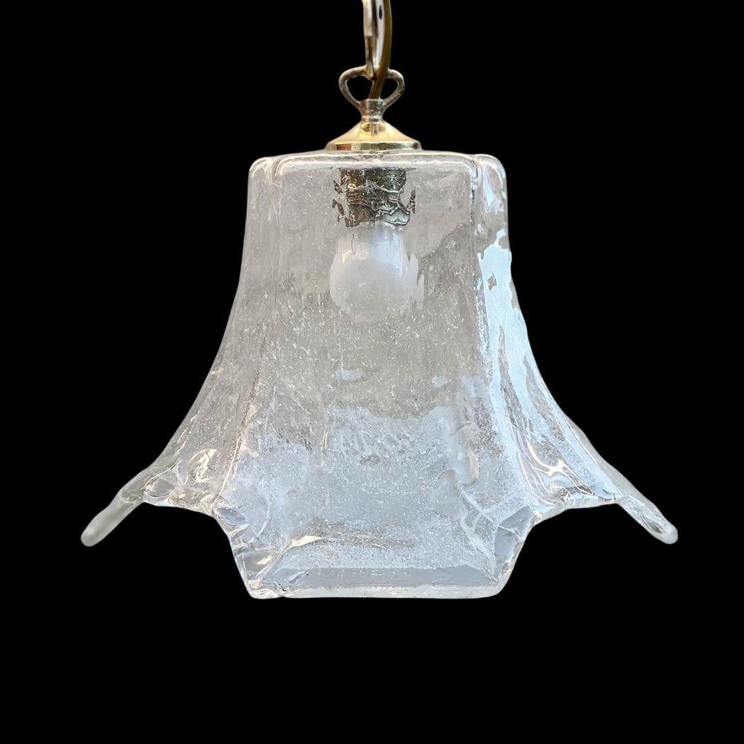 Stylish chandelier from the famous German light company Hönsel Leuchten

- Solid textured Murano glass with ice effect.

- The plafond itself was made in Murano, Venezia, Italy.

- Circa 1970s.


Italian artistry and elegance embodied. Honsel's
