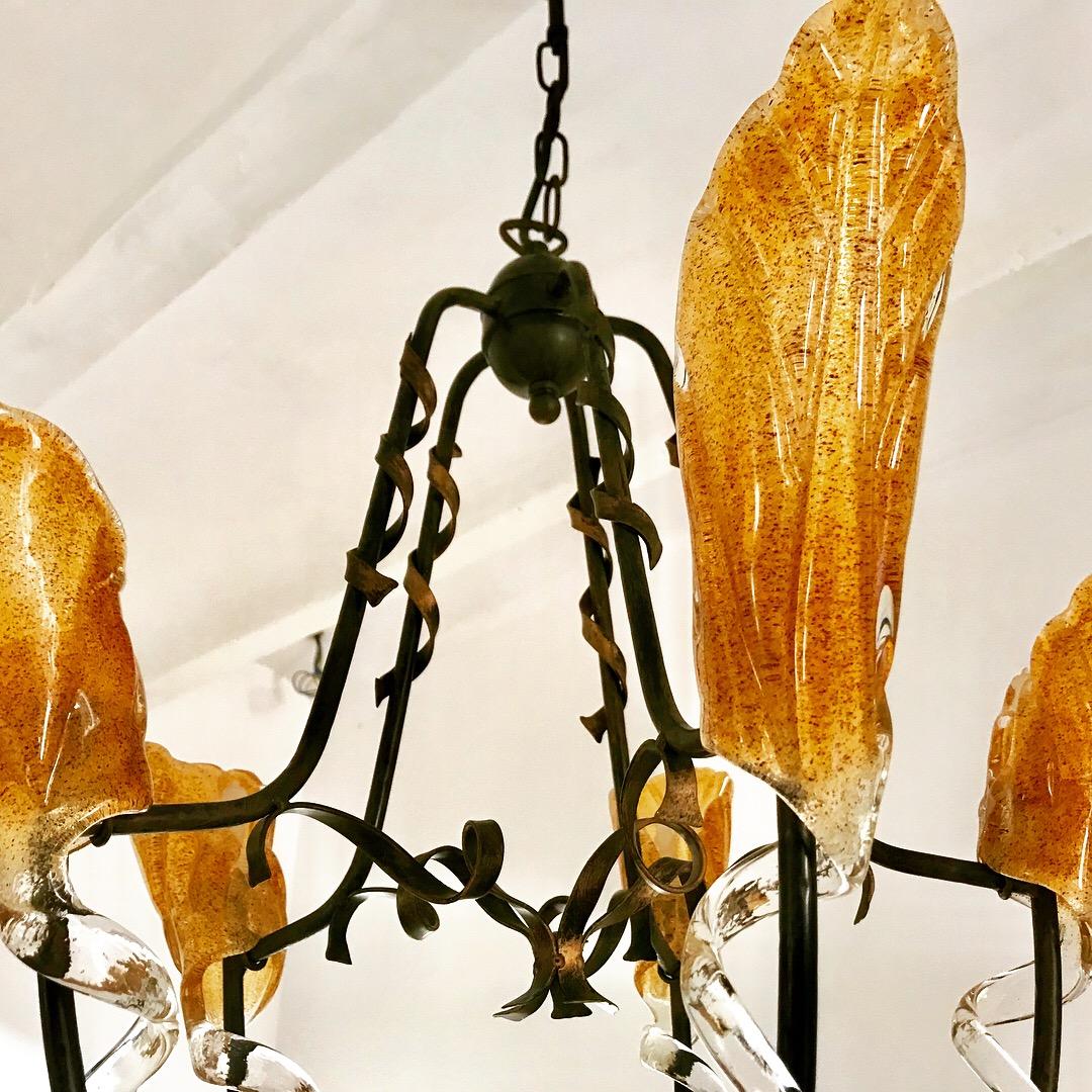SUPERBE Gold yellow glass Murano oversized with black metal structure. The Design and the quality of the glass make this piece the best of the italian Design.
This superb Model in Gold orange glass with meditteraen structure.
This Pieces of Arts