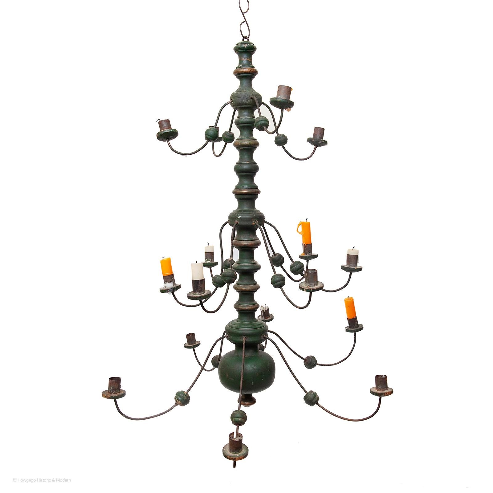 RARE FOLK OR VERNACULAR, 19TH CENTURY, GREEN PAINTED AND GILDED, 3 TIER, CHANDELIER WITH 16 BRANCHES OR ARMS, 76cm., 30” high

Exudes folk/vernacular charm, character and atmosphere
Three tier, folk chandeliers are rare as most were made for