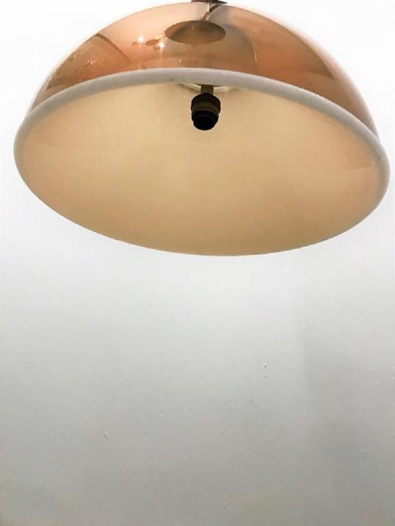 Lamp interior attributed at Stilux. Chandelier which renews the classical vocabulary of half-sphere thanks to colors and finishes that make it extremely timely and suitable for contemporary living. Formed by an inner part of conical shape in white