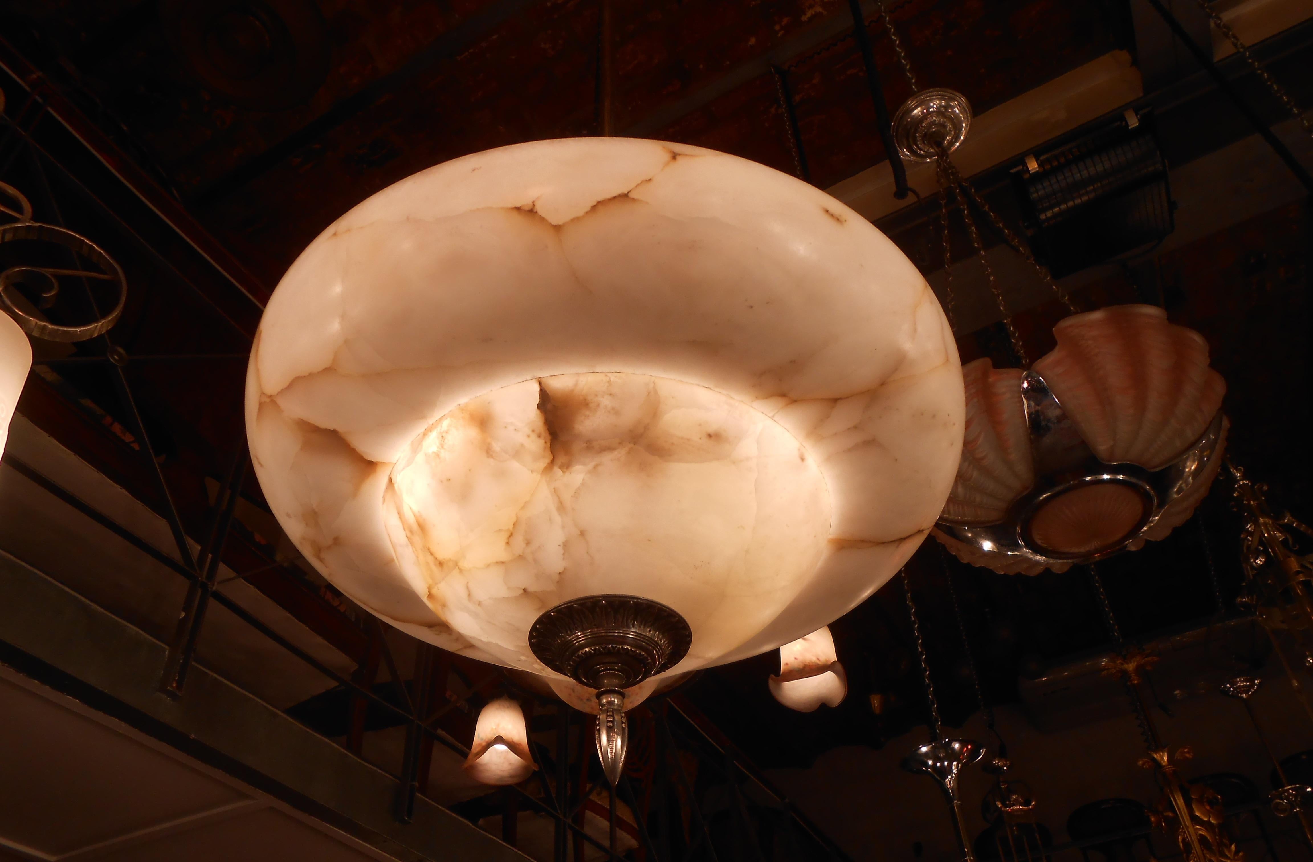 Chandelier in alabaster.

Style: Art Deco
Year: 1920
Materials: Alabaster and silver plated bronze
To take care of your property and the lives of our customers, the new wiring has been done.
If you want to live in the golden years, this is the