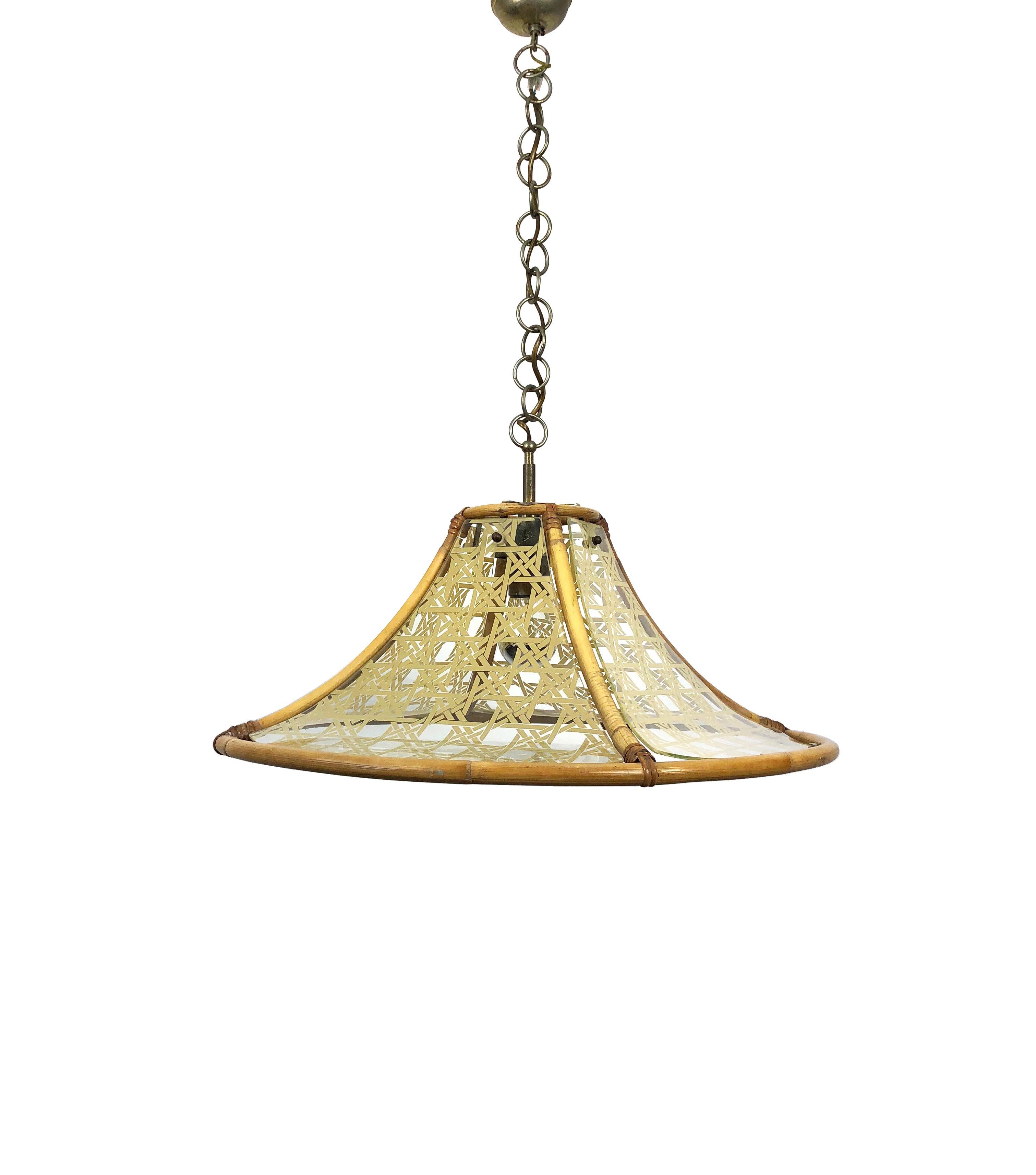 Midcentury Italian chandelier in textured glass and rattan featuring bamboo structure and metal pendant, circa 1960.