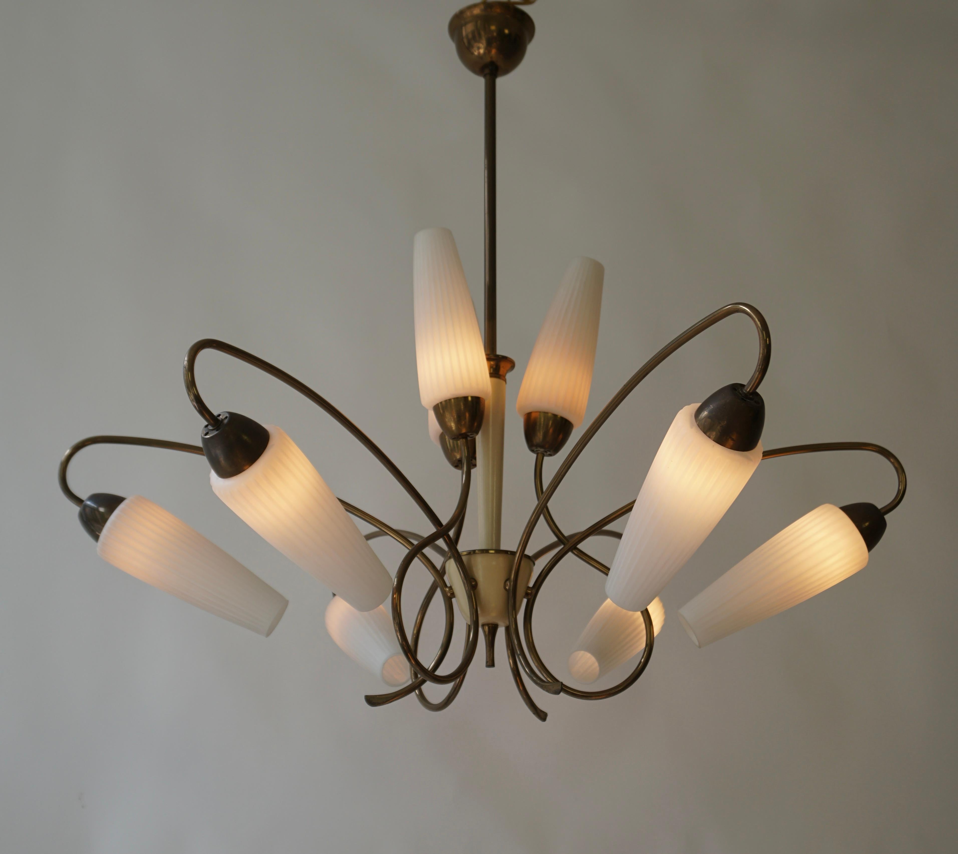 Beautiful modernist 1950s chandelier with opal glass on brass fitting in the style of Stilnovo.. 

The lamp requires nine E14 bulbs with Edison screw thread.The wiring is in very good condition and works worldwide.

Diameter 80 cm.
Height 73 cm.