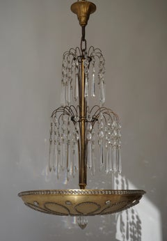 Chandelier in Gilded Metal and Crystal