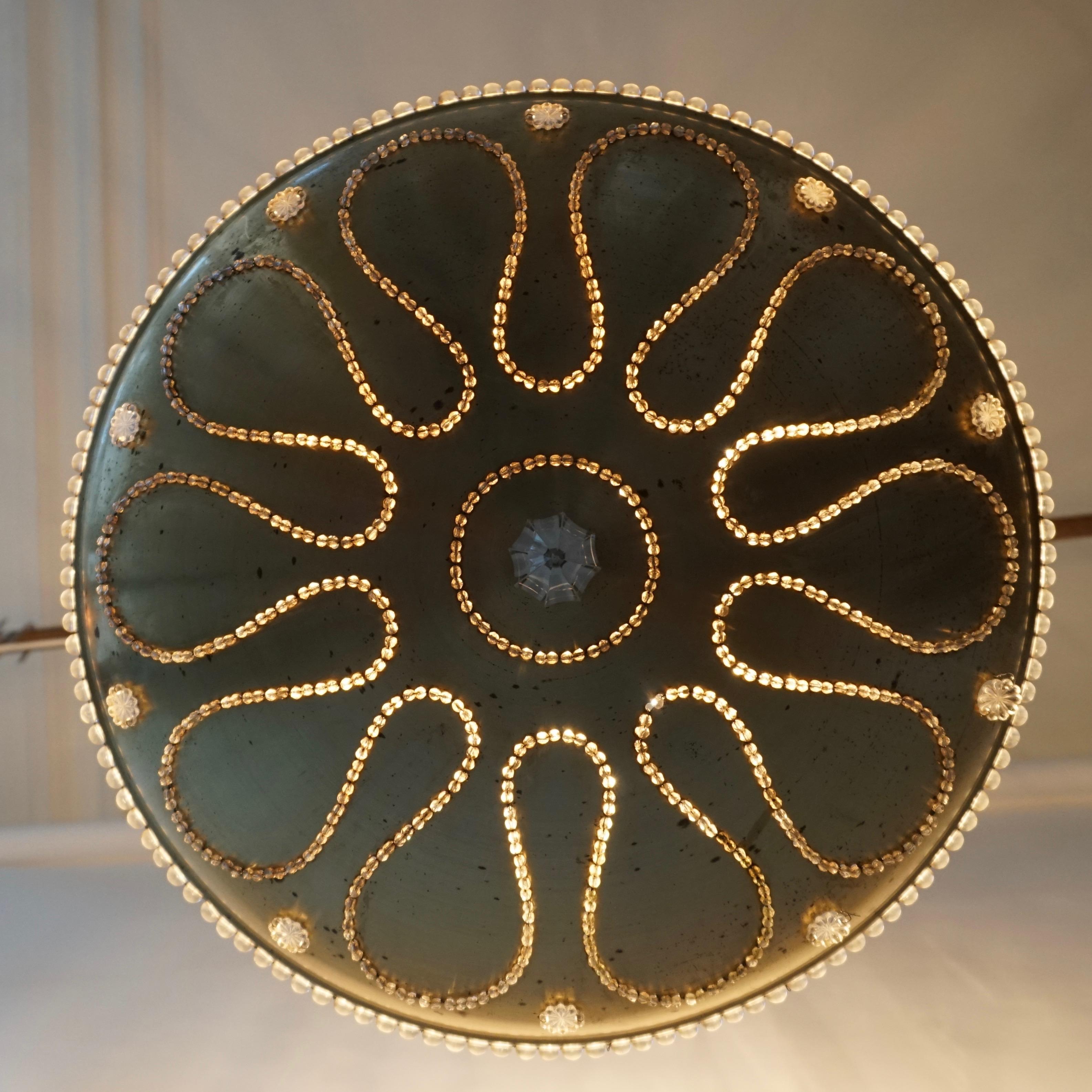 Ottone Lampadario in metallo dorato e cristallo in vendita