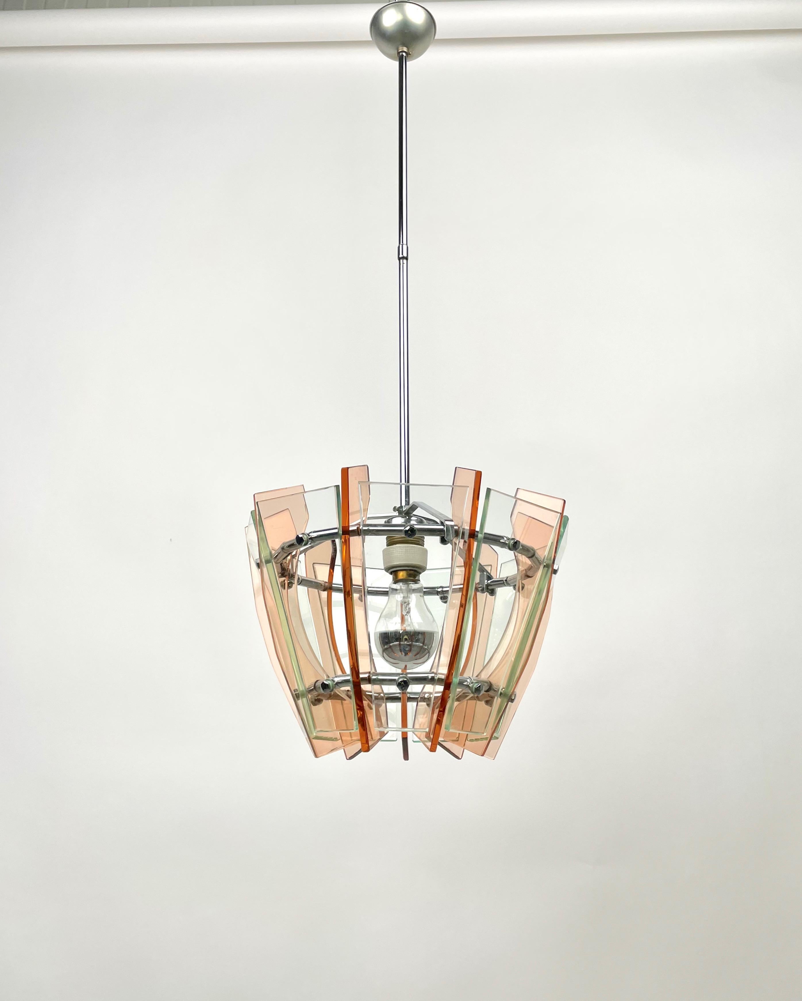 Chandelier pendant in colored glass (green & orange) and chrome by Veca, Italy, 1970s.

Measures: Height with pole: 80 cm
Height without pole: 23 cm.
Diameter: 32 cm.