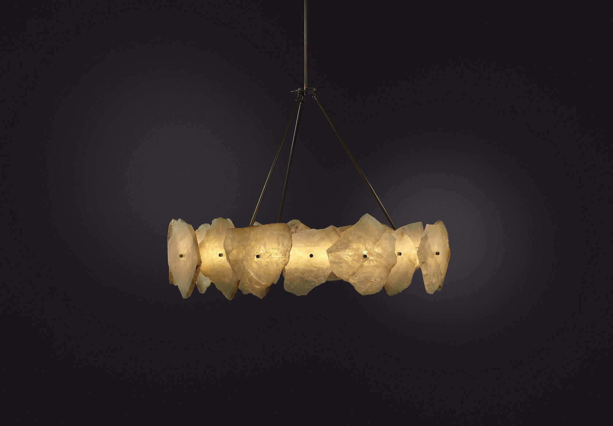 Contemporary Chandelier in Quartz Slices and Brass - Petra III Circular 1100 by Christopher Boots

PETRA (from the Greek ??t?a, meaning stone) celebrates the subtleties and complexities of quartz. Quartz was highly revered by the ancients who