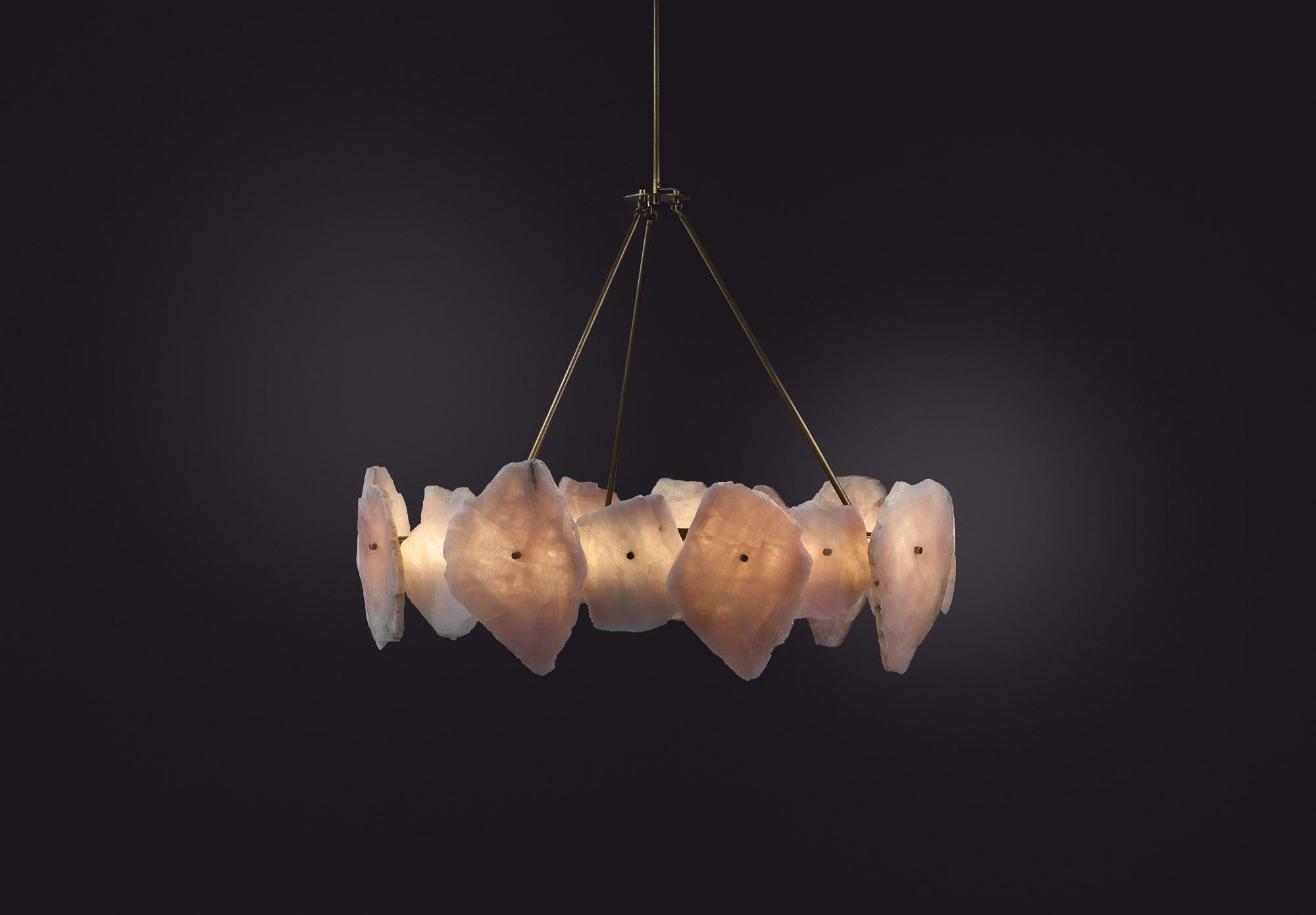 Contemporary chandelier in Quartz Slices and Brass - Petra III Circular 1100 by Christopher Boots

PETRA (from the Greek, meaning stone) celebrates the subtleties and complexities of quartz. Quartz was highly revered by the ancients who believed