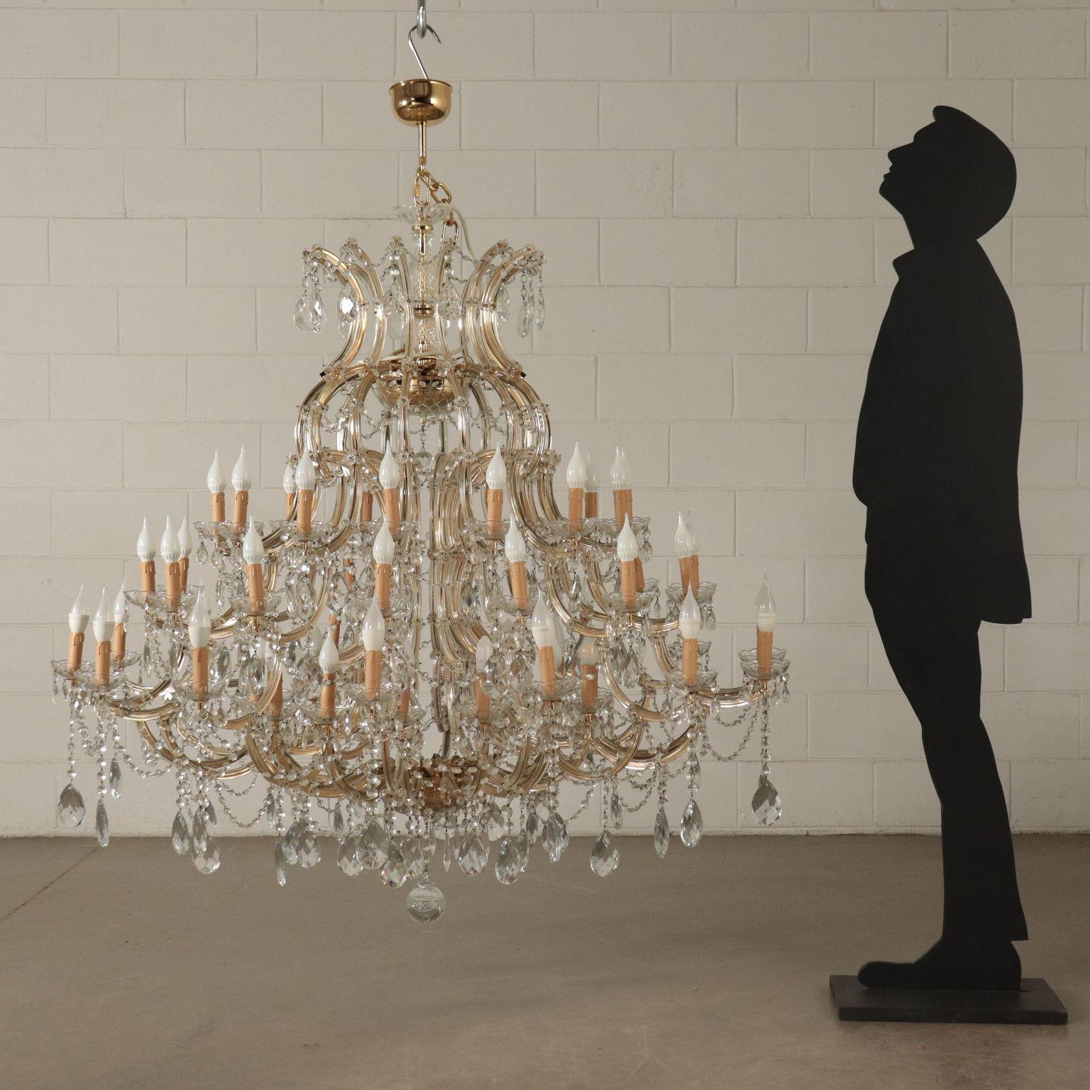 Fifty-six lights chandelier in the style of Maria Theresa embellished with glass pendants.