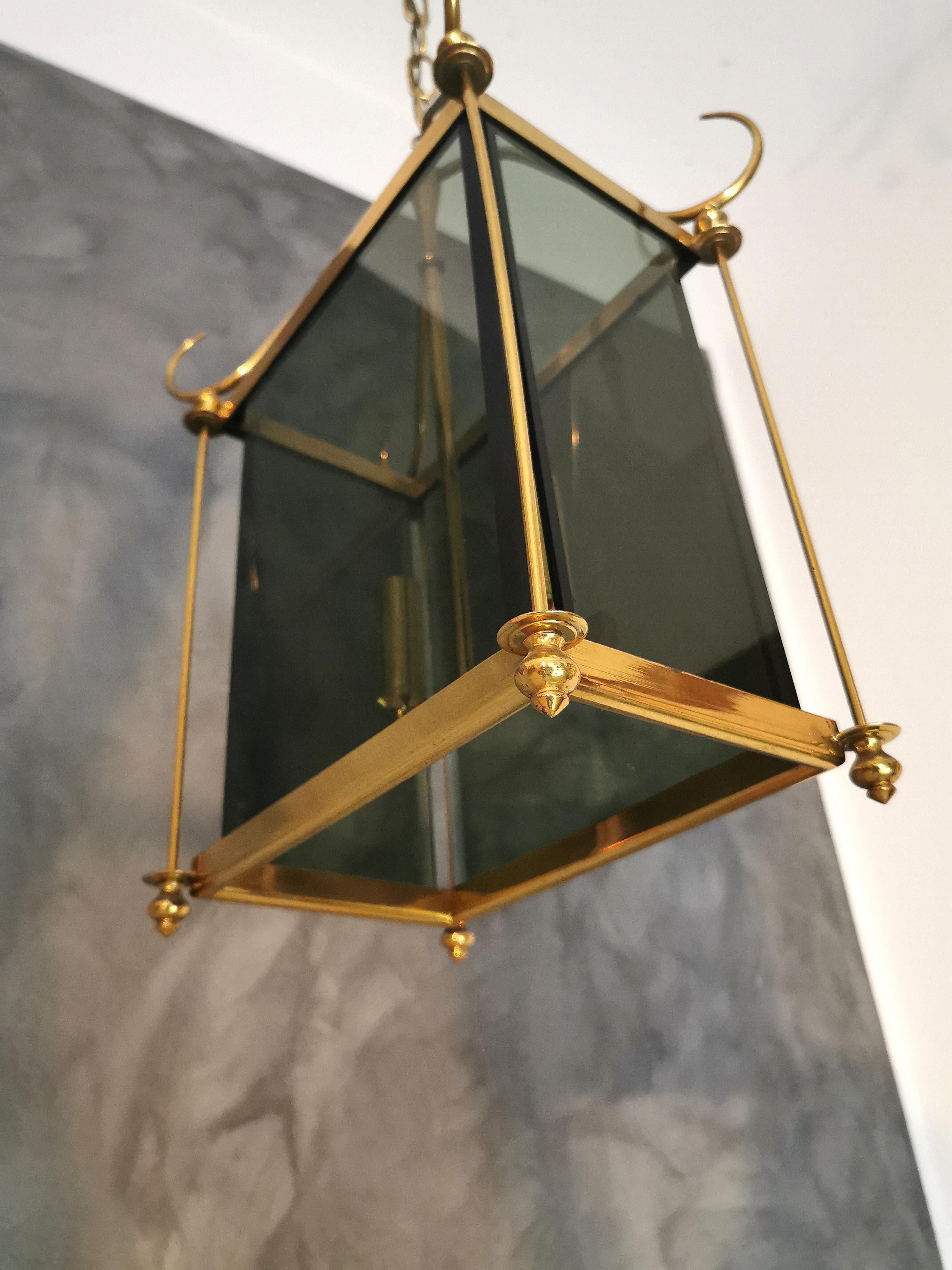 Suspension chandelier in the style of Pietro Chiesa with two lights with brass structure and smoked beveled glass. Italy in the 1960s.