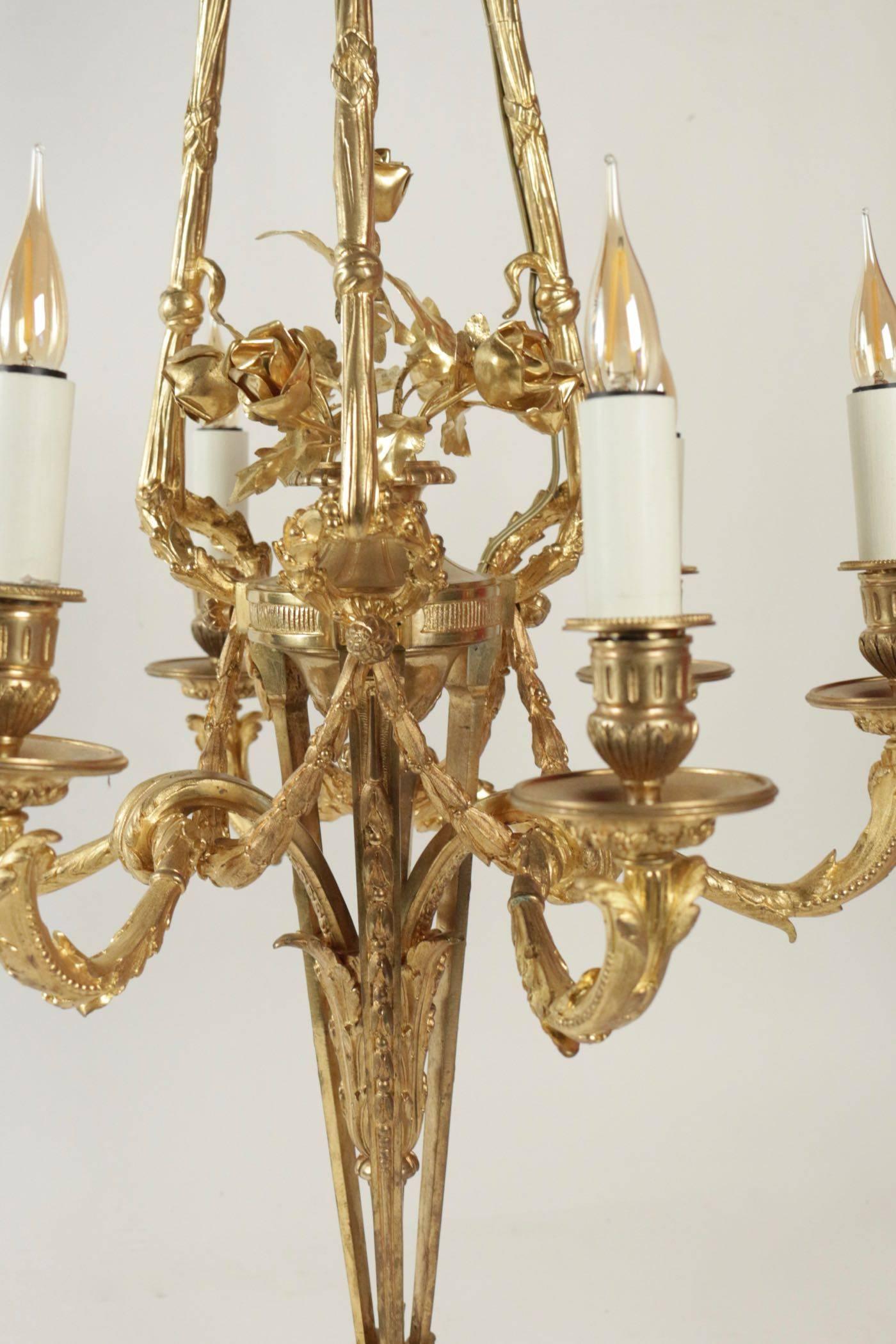 Louis XVI style gold gilt on bronze 19th century period Napoleon III chandelier with six arms.
Measure: H 85cm, D 54cm.
 
 