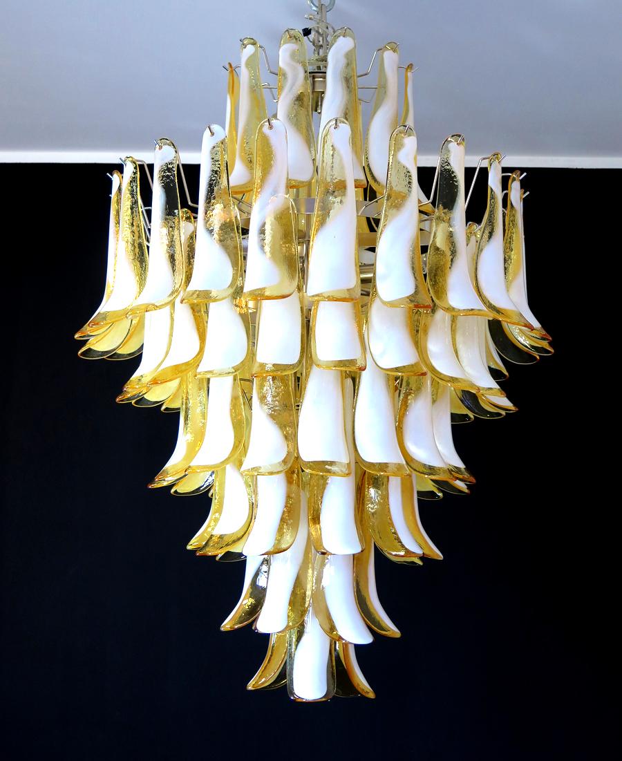 Handblown glass chandelier, composed of 85 curved, caramel lattimo glass pieces, which are arranged on 7 tiers, suspended from a nickel metal structure.
Period: late xx century
Dimensions: 47,25 inches (120 cm) height without chain; 31,50 inches
