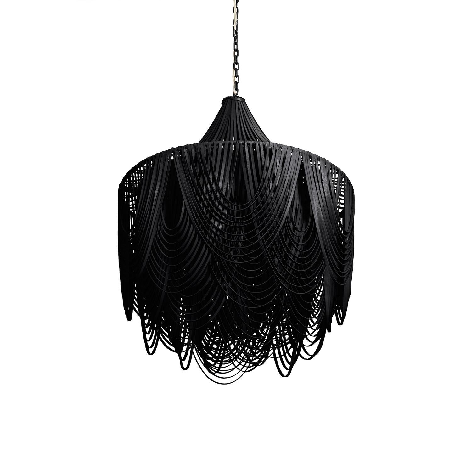 Perhaps the most unexpected textile for a light fixture, the leather Whisper Chandelier is handcrafted with swags of leather layered in graceful arcs for a stunning-yet- natural look. The ambient light from within the fixture provides a soft