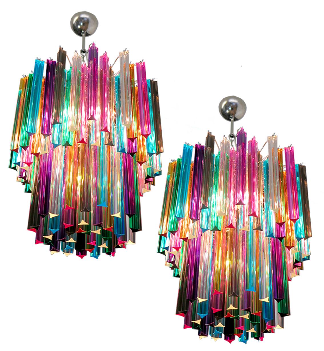 Fantastic Murano chandelier made by 107 Murano crystal multicolored prism in a nickel metal frame. The glasses are transparent, blue, smoky, purple, green, yellow and pink.
Dimensions: 55.10 inches height (140cm) with chain, 29.50 inches height