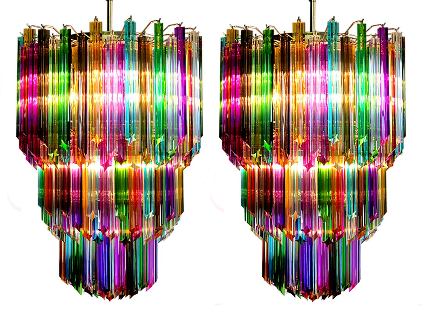 Fantastic vintage Murano chandelier made by 184 Murano crystal multicolored prism (QUADRIEDRI) in a nickel metal frame. The glasses are transparent, blue, smoky, purple, green, yellow and pink. The glasses have two different sizes.
Period: