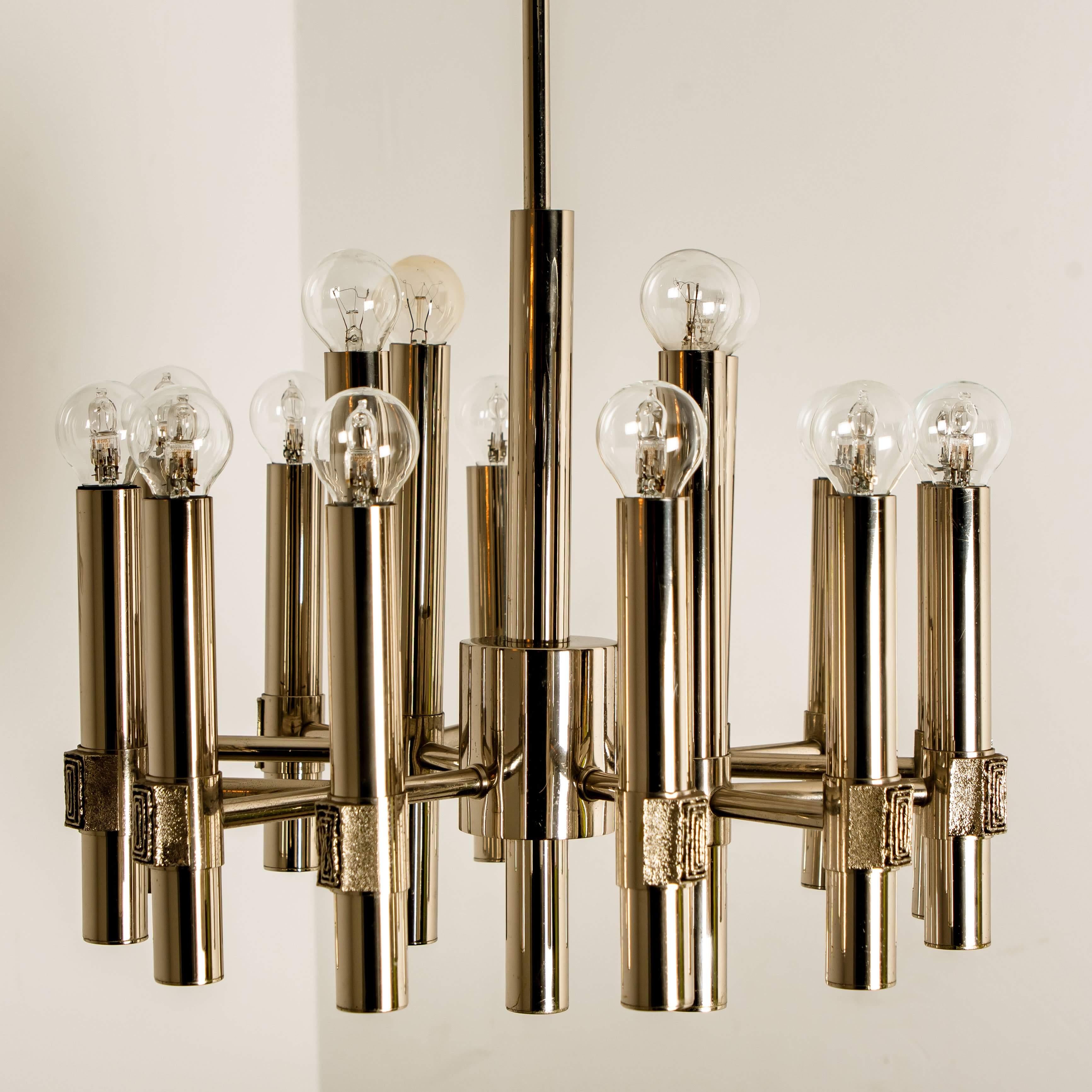 Impressive sputnik style chandelier by Angelo Brotto for Esperia Italia, brass ramificated structure with 12 arms.

Dimensions:
35.4 inch (90 cm) height (total height) height only the body 14.6 inch (37 cm)
Diameter 17.3 inch (44 cm).

Cleaned