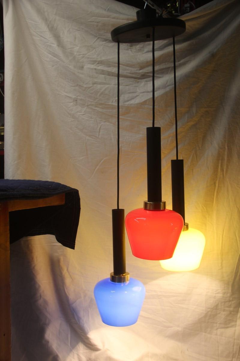 Chandelier pendant midcentury Italian design Vistosi 1950 black, yellow, blu, red Murano glass.
3 light bulbs E27 max 80 Watt each.