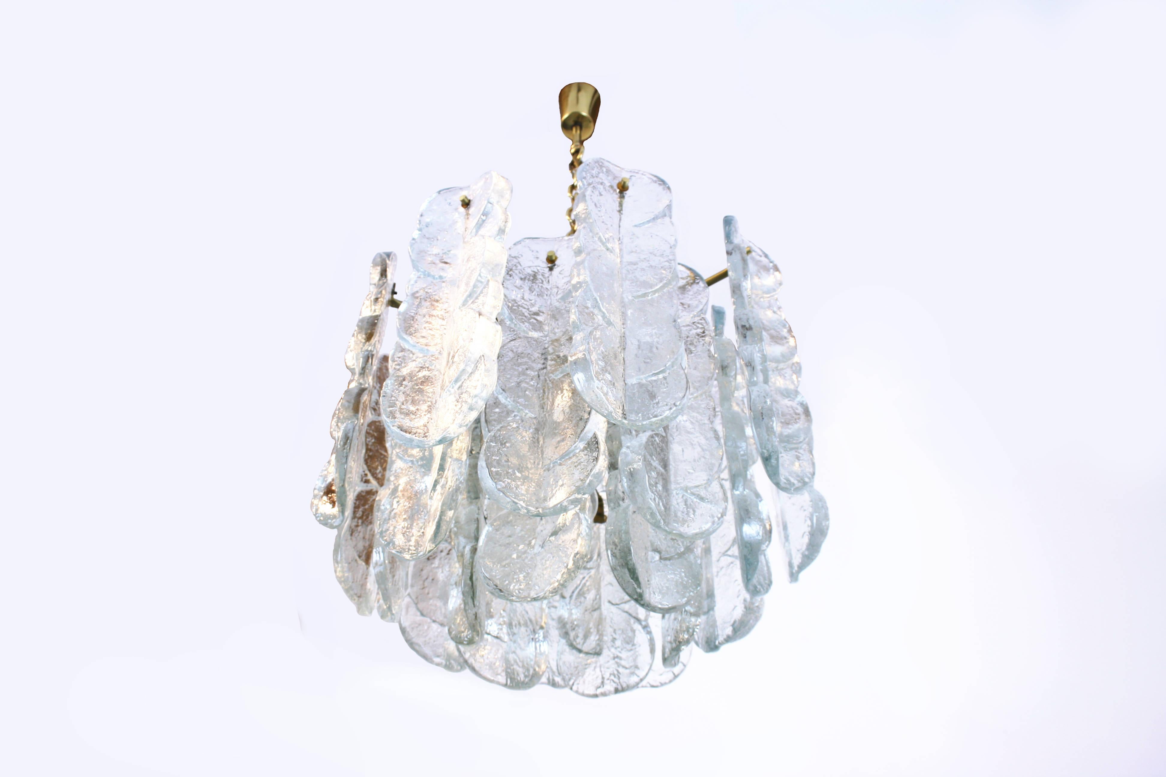 Citrus Swirl chandelier or pendant by J.T. Kalmar from Vienna, Austria. A skilfully produced object revealing an impressive presence. The thick and quite heavy glass pieces are fixed with brass screws on a solid brass frame. The refraction of the