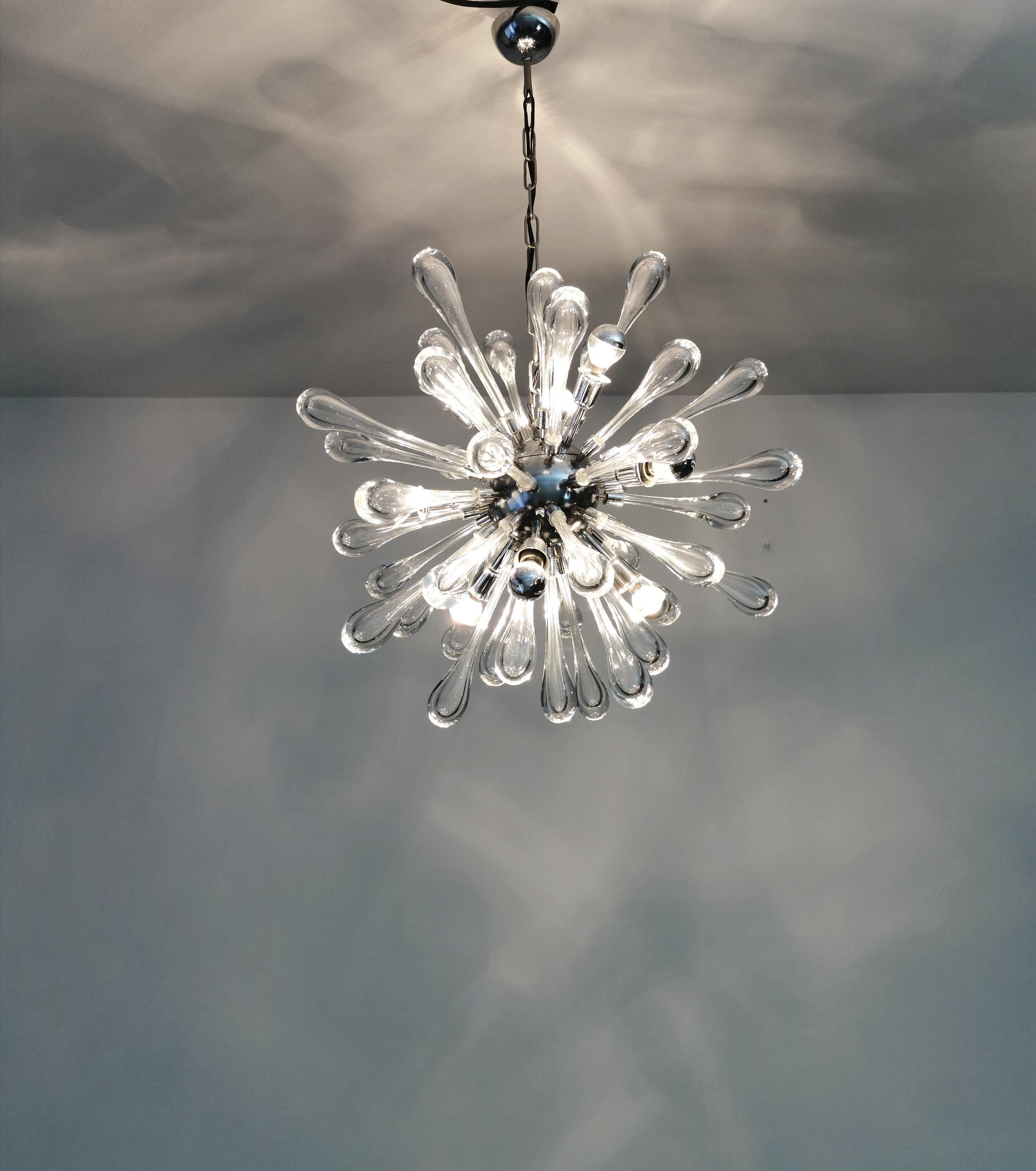 Suspension lamp with nine lights E14 model Sputnik, circular body with 40 drop glasses in transparent and heat-worked solid Murano glass. Murano production from the 1960s.