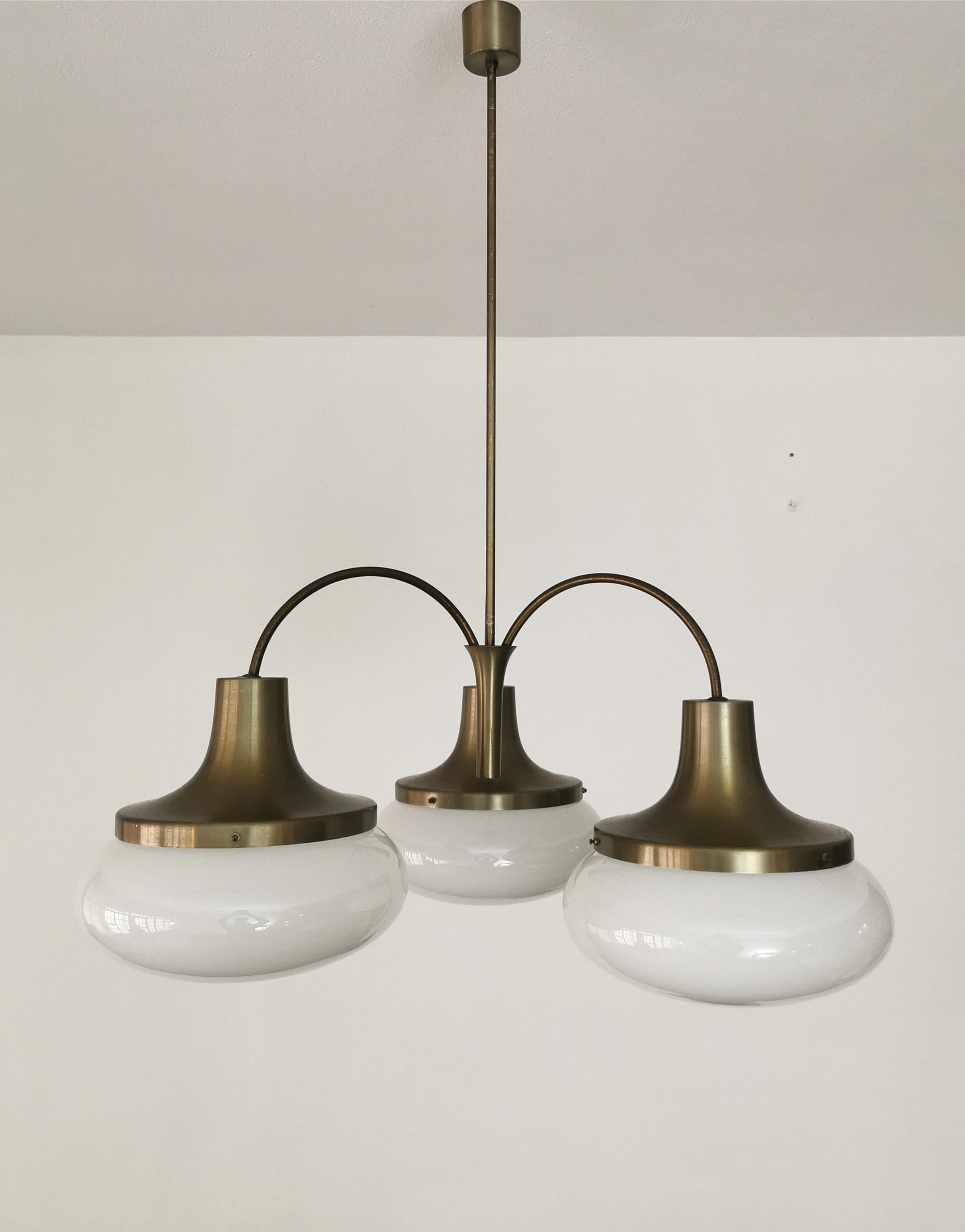 E27 3-light chandelier produced by the Italian company Stilux in the 70s. The chandelier has a bronzed aluminum structure that supports 3 half-sphere bowls in milky glass.



Note: We try to offer our customers an excellent service even in shipments