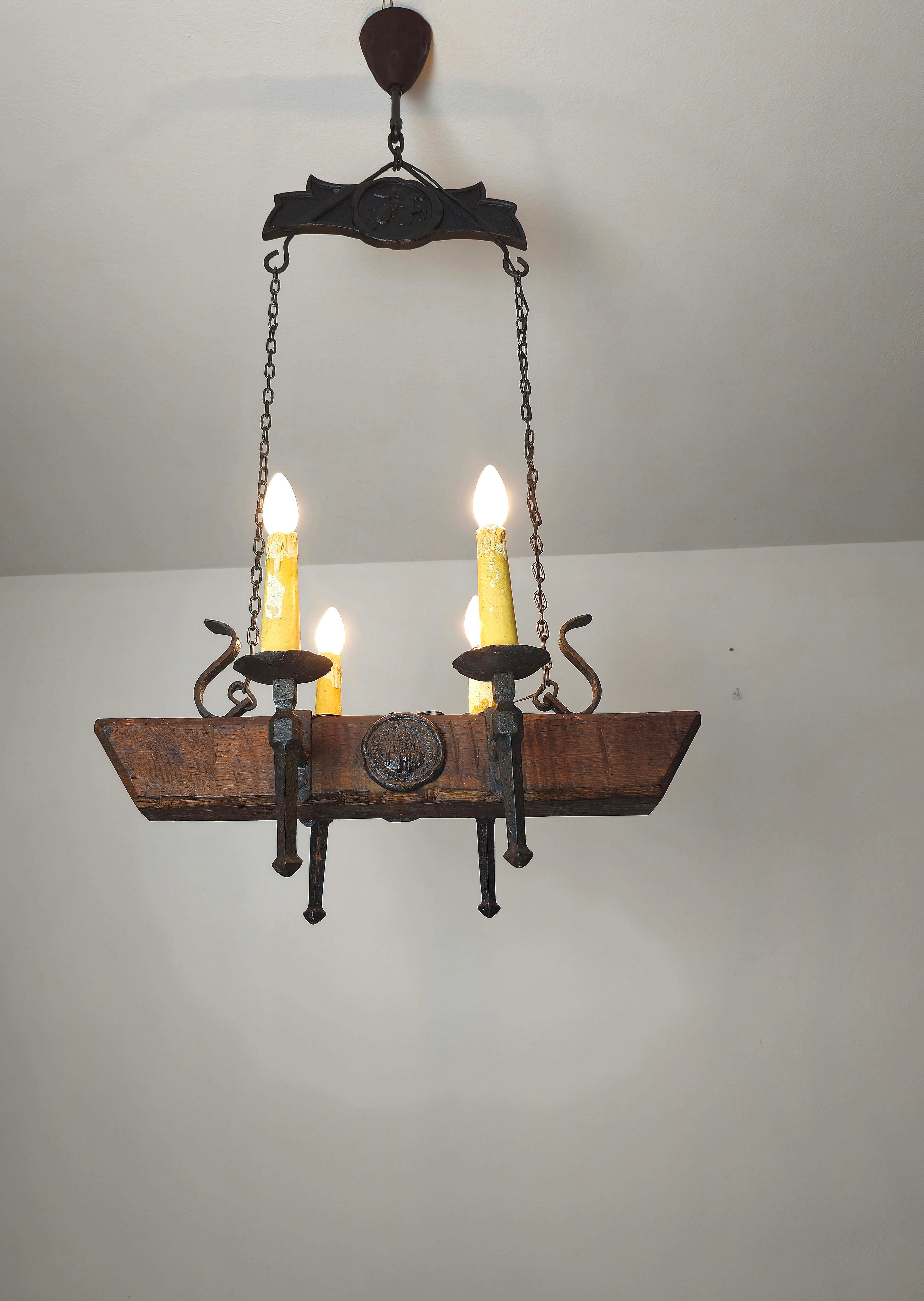 Particular Gothic style chandelier made of wrought iron and wood. Made in France in the 1940s.


Note: We try to offer our customers an excellent service even in shipments all over the world, collaborating with one of the best shipping partners,