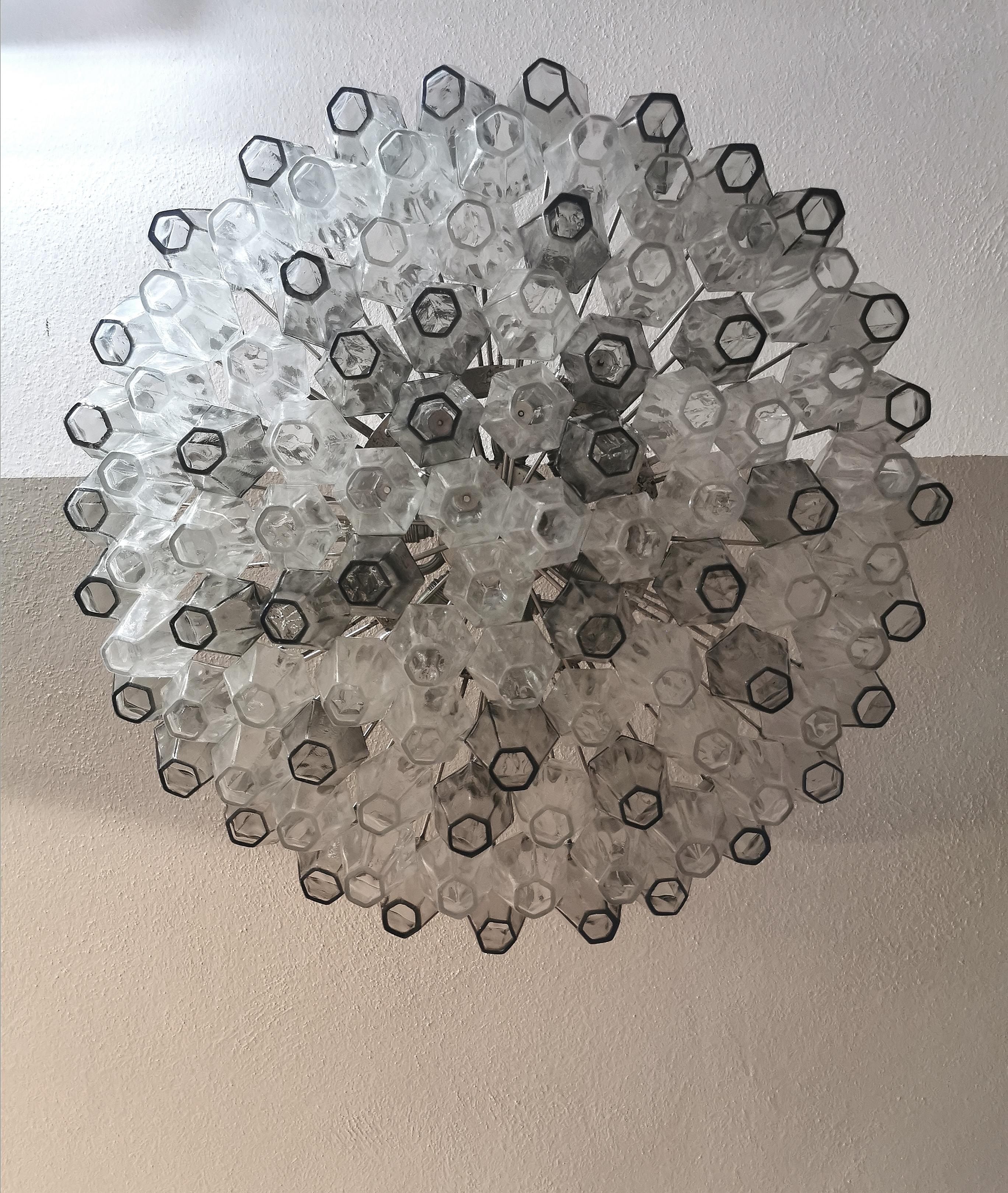 Chandelier designed by the Italian designer Carlo Scarpa and produced by the prestigious Venetian company Venini in the 1960s. The chandelier has 102 gray and transparent Murano glass 