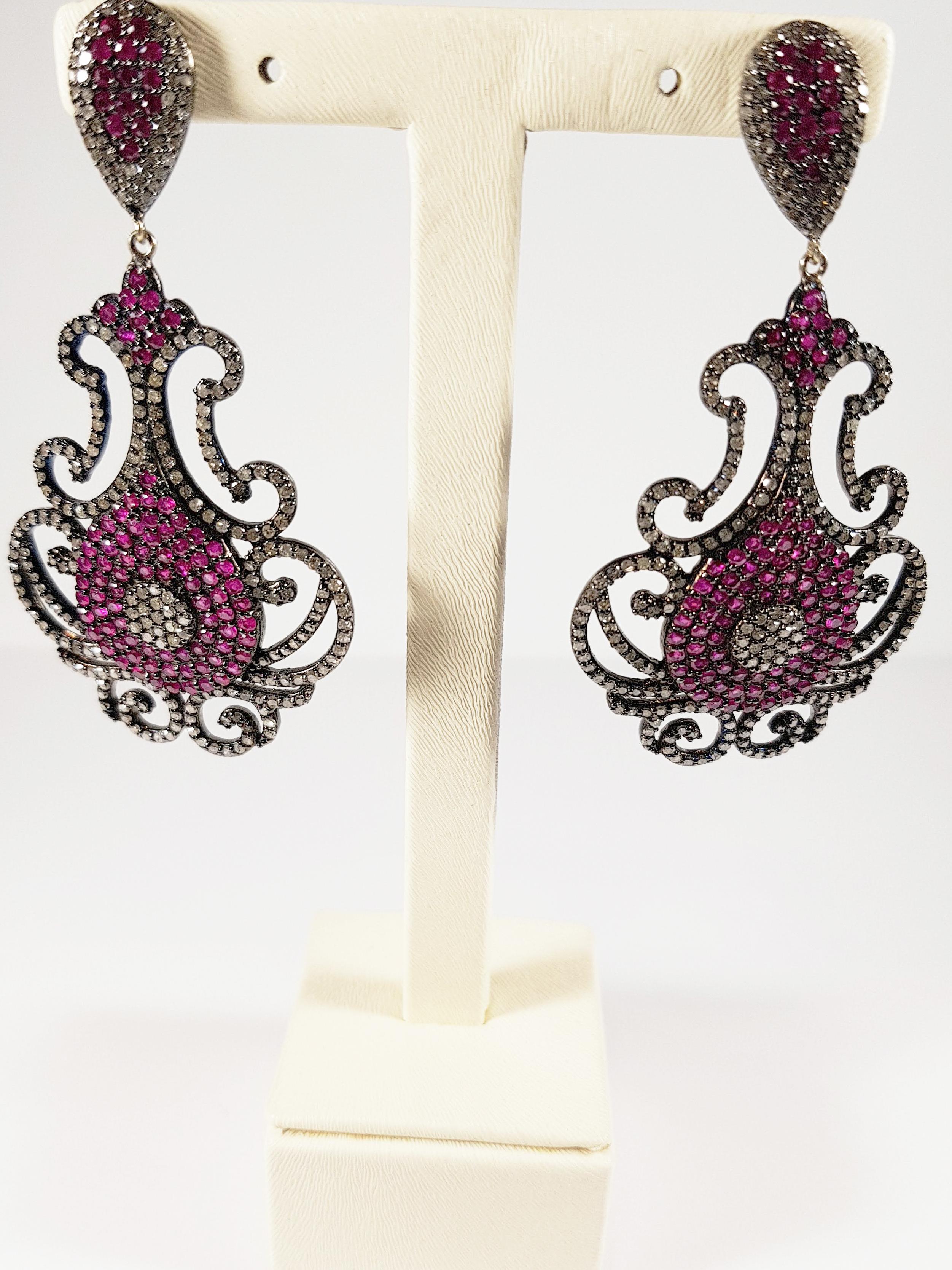 Chandelier Ruby, Diamond 14k gold earrings 
Irama Pradera is a Young designer from Spain that searches always for the best gems and combines classic with contemporary mounting and styles
She creates many Jewels in her atelier in Bilbao, and she