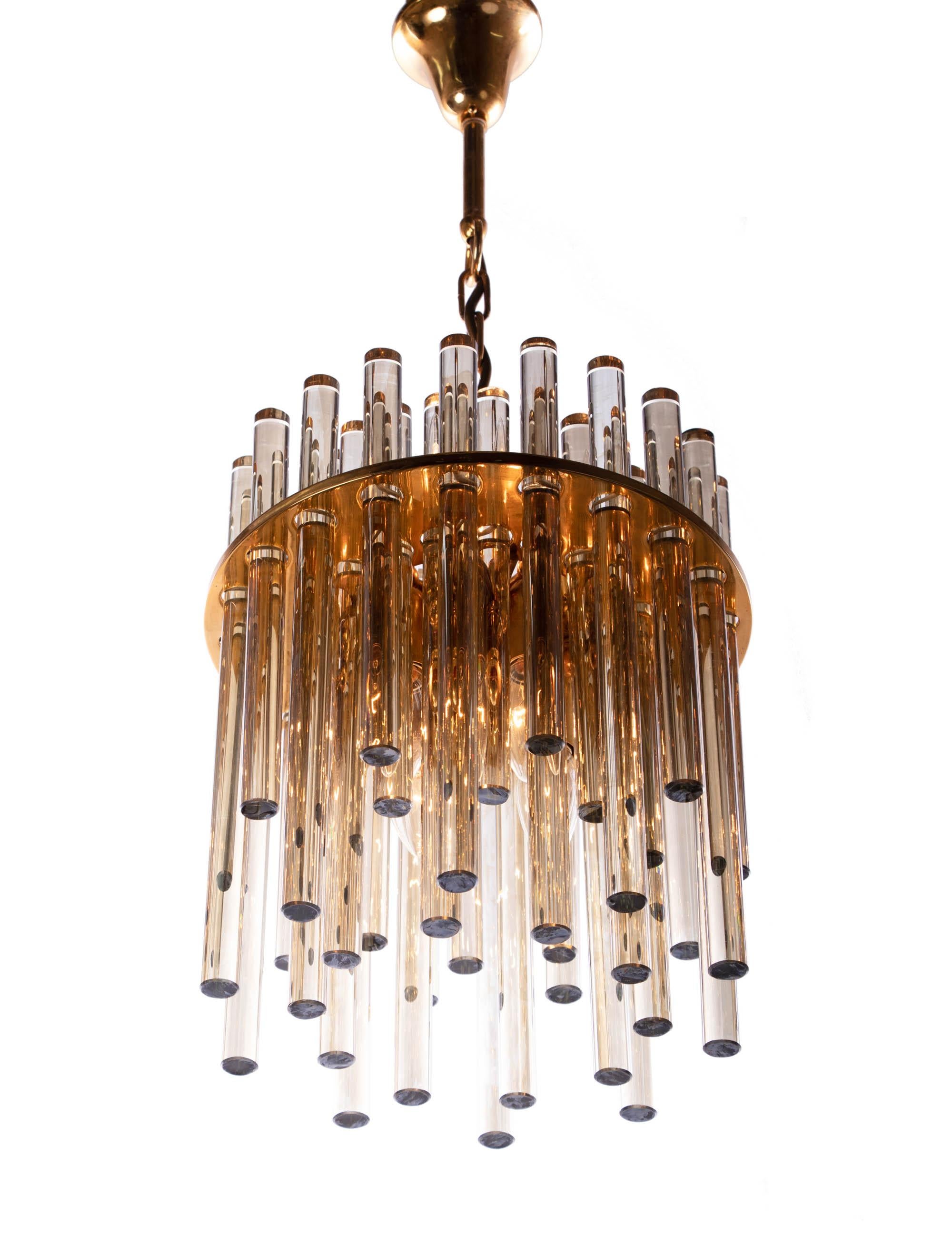 Elegant pendant lamp with smoked amber Murano glass rods on a gilded brass frame. Chandelier illuminates beautifully and offers a lot of light. Designed by Palme & Walter for Palwa Lighting, Germany in the 1960s. 

Design: Christoph Palme.