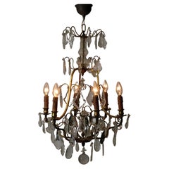 Lampadario con pendenti in cristallo incolore,  Vetro fumé per champagne.