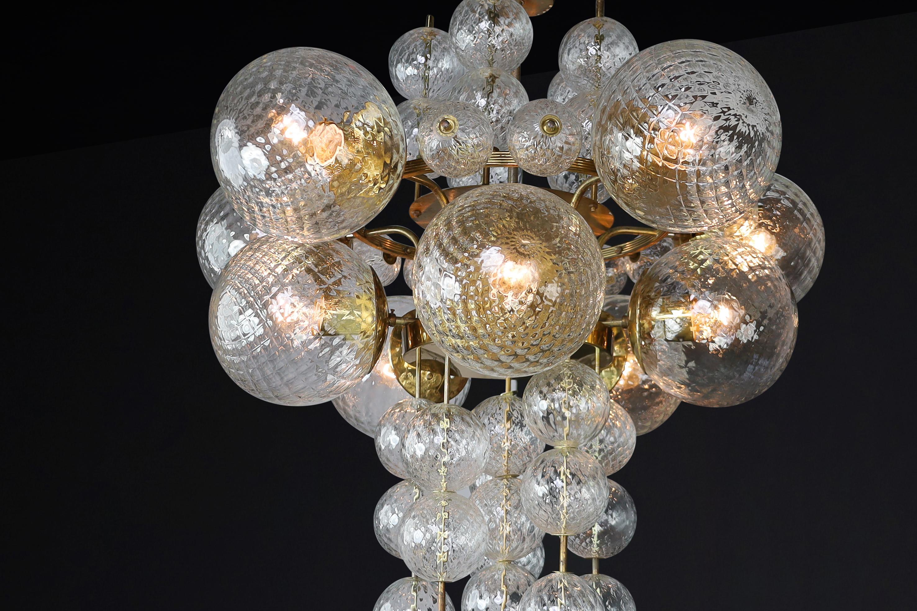 Mid-Century Modern  Chandelier with Patinated brass fixture and hand-blowed glass globes  CZ 1960s For Sale