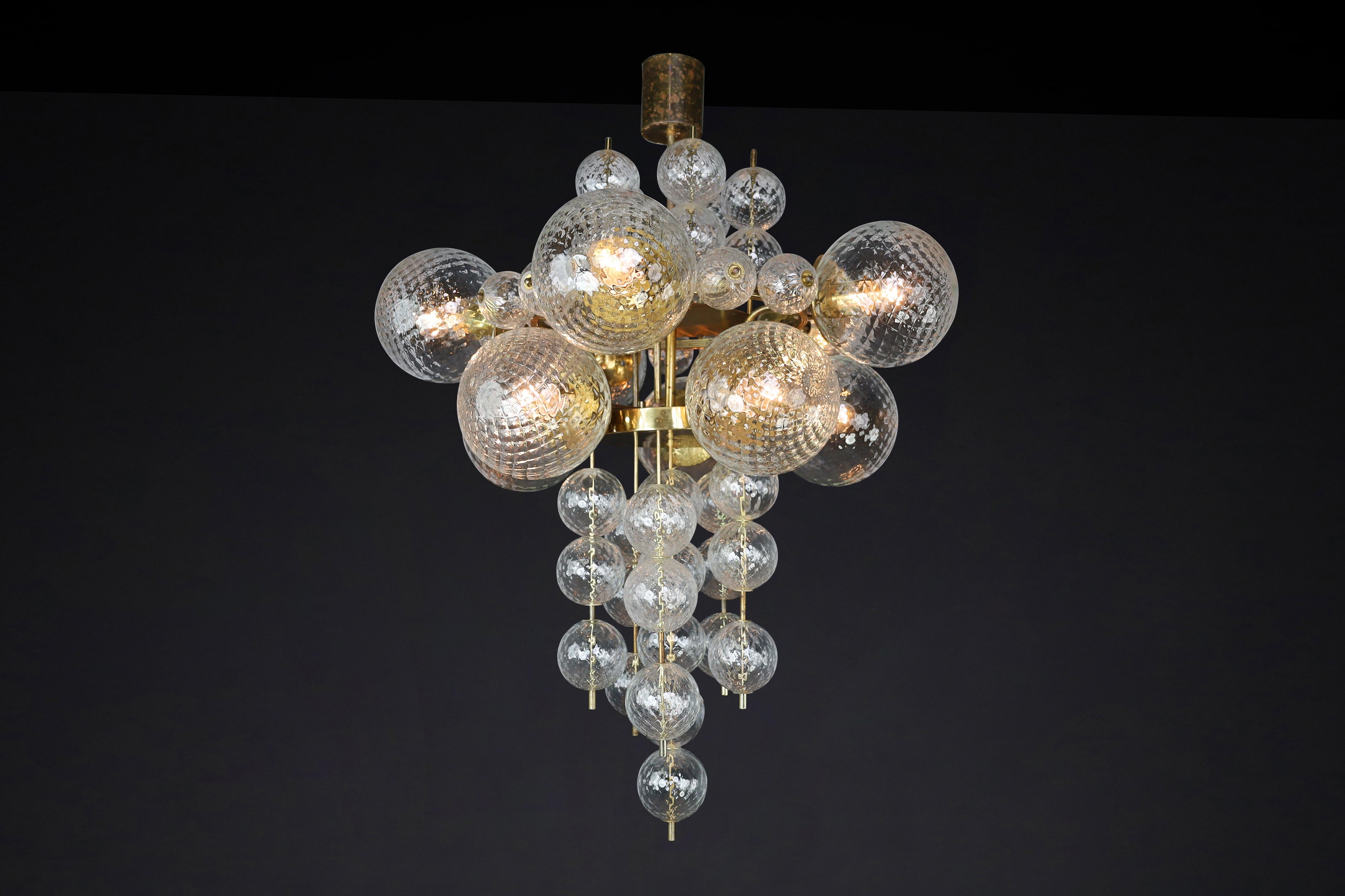 Mid-20th Century  Chandelier with Patinated brass fixture and hand-blowed glass globes  CZ 1960s For Sale