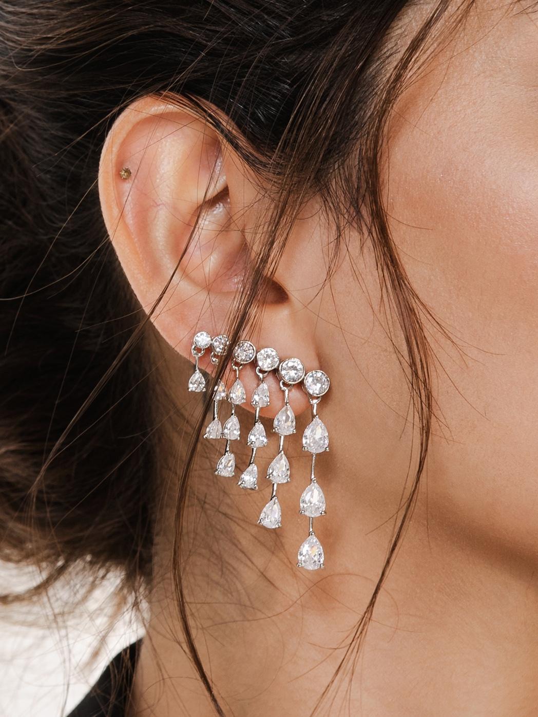 Chandelier Zircon Dangle Earrings in sterling silver. You shall need these dangle earrings to make a statement with your look. Each piece features dazzling cubic zirconia stones, renowned for their brilliance and clarity, set in high-quality