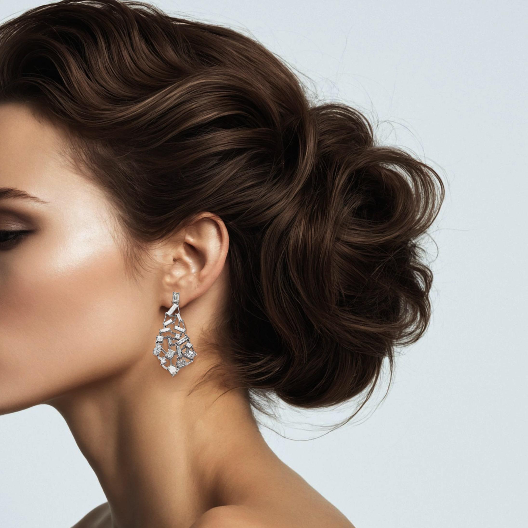 Make a statement with these exquisite 18k white gold chandelier earrings, featuring a cascade of natural diamonds in a free-flowing design. With their elegant length of 1.75 inches, these earrings bring a touch of glamour and sophistication to any