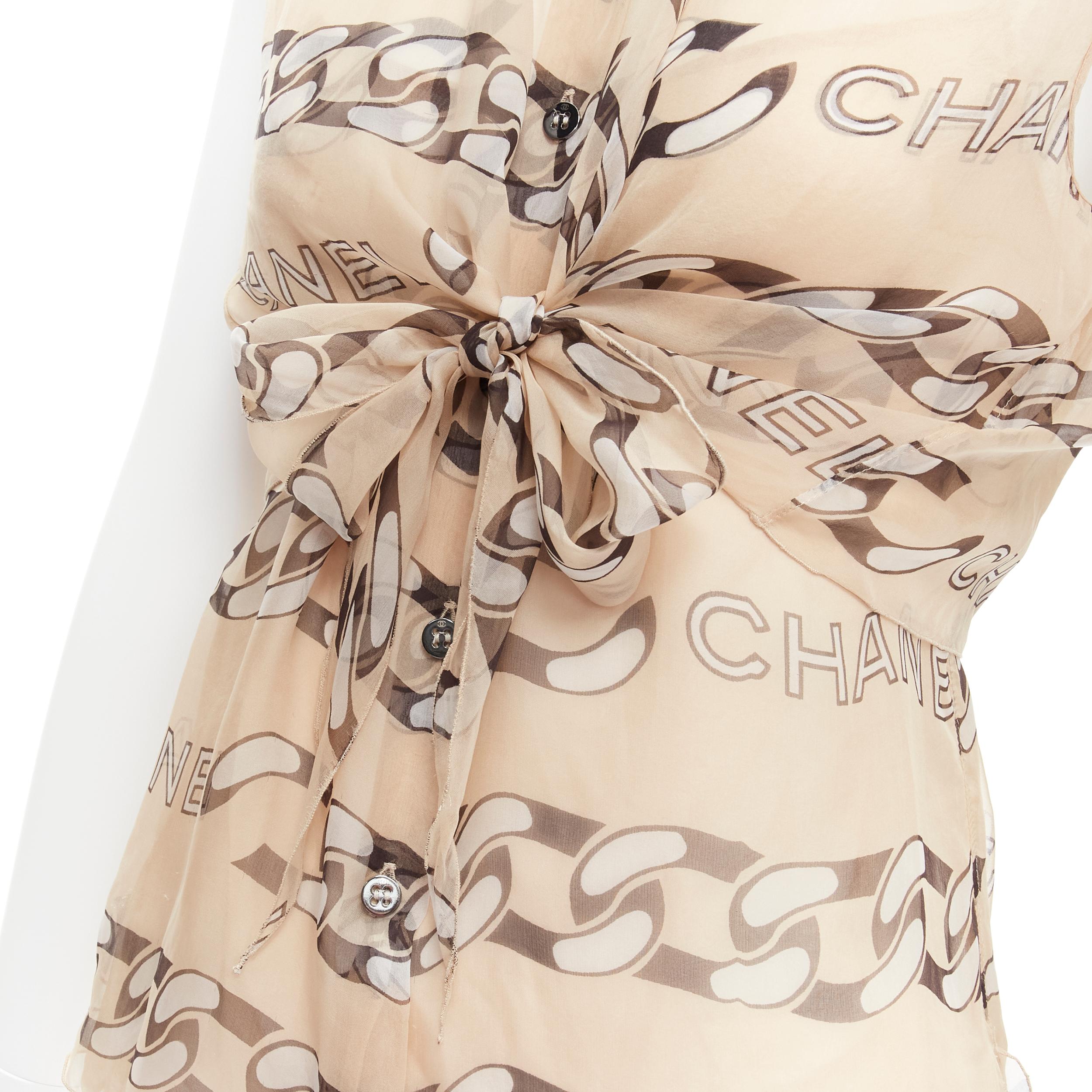 CHANEL 01A Vintage Runway black CC logo chain nude silk front tie blouse FR40 M
Reference: TGAS/C02013
Brand: Chanel
Designer: Karl Lagerfeld
Collection: Fall 2001 - Runway
Material: Silk
Color: Nude, Black
Pattern: Abstract
Closure: Self