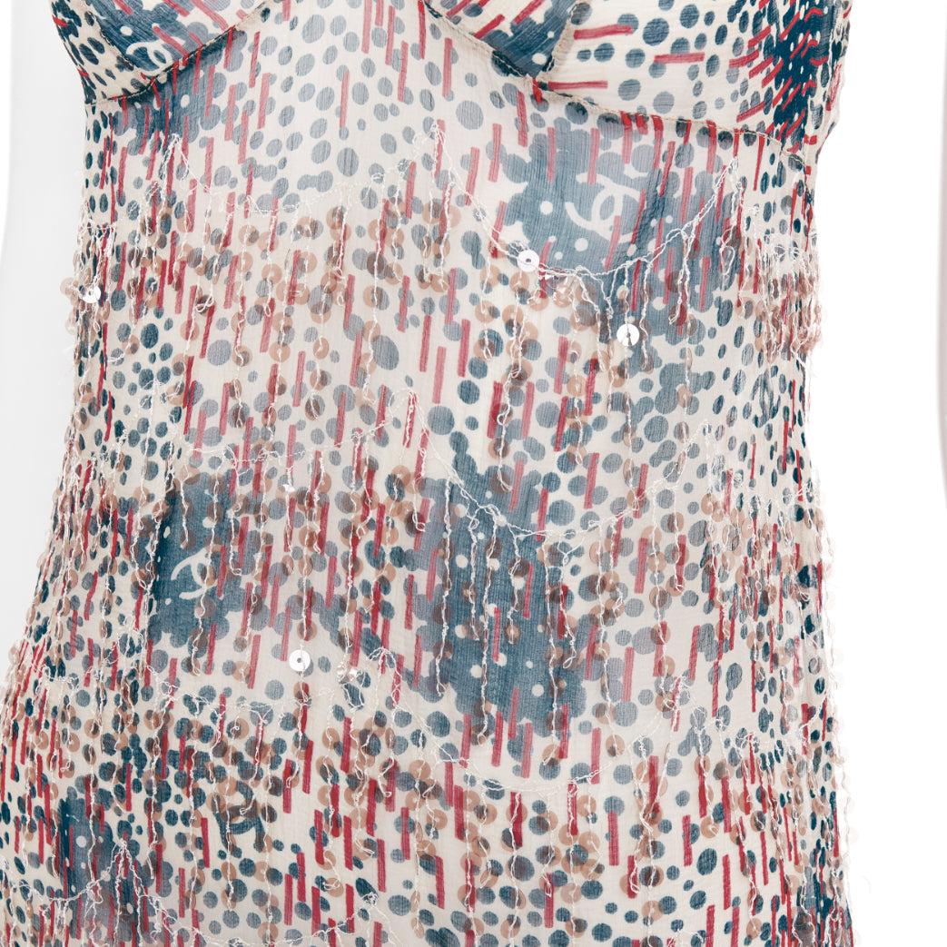 CHANEL 02A camisole transparente à franges et appliques à sequins rouge beige FR38 M
Référence : TGAS/F00021
Marque : Chanel
Designer : Karl Lagerfeld
Collectional : 02A
MATERIAL : Soie
Couleur : Beige, Rouge
Motif : Abstrait
Fermeture :
