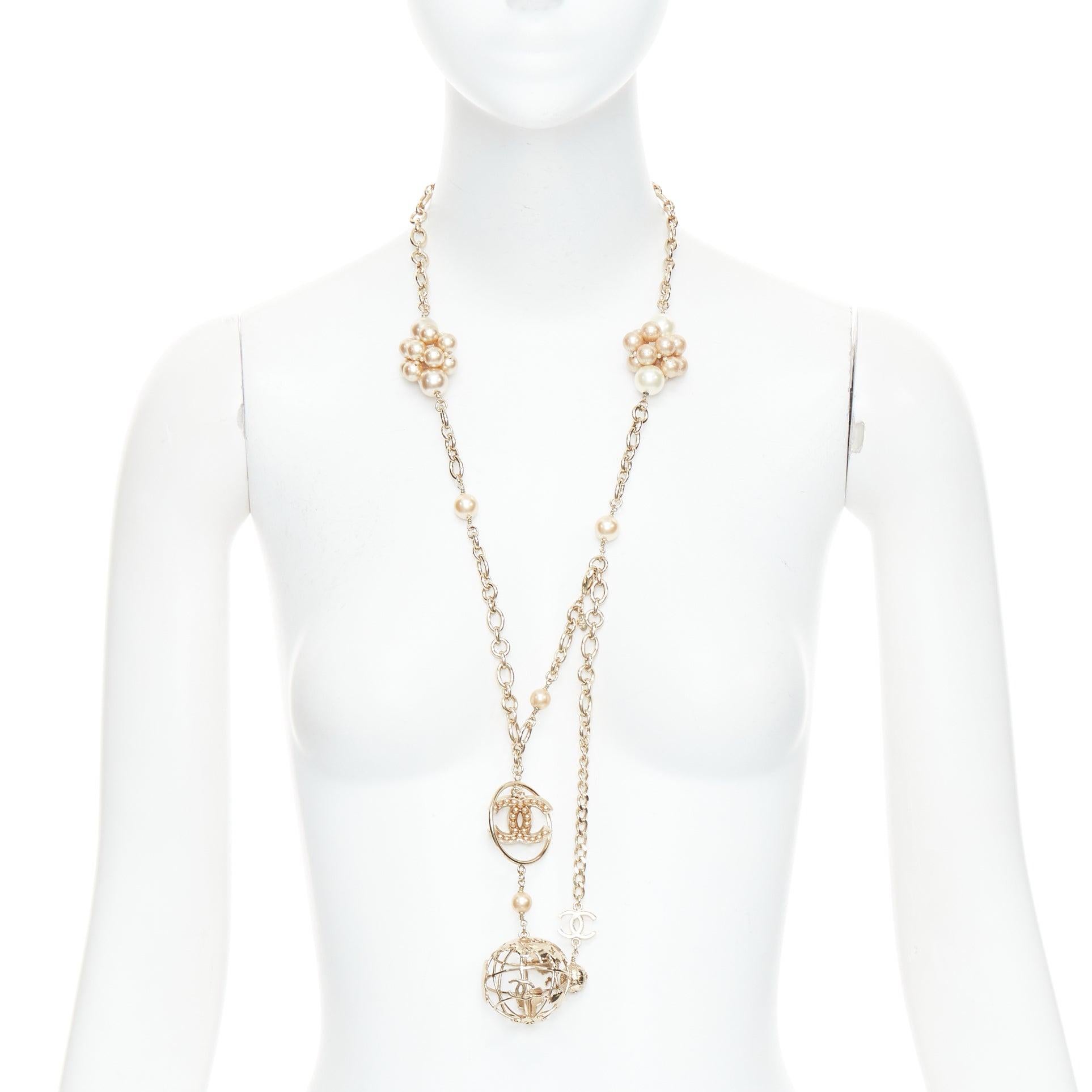 CHANEL 04A gold tone CC logo pearl globe charm chain belt necklace
Reference: TGAS/E00839
Brand: Chanel
Designer: Karl Lagerfeld
Collection: 04A
Material: Metal, Faux Pearl
Color: Gold, Pearl
Pattern: Solid
Closure: Lobster Clasp
Extra Details: The