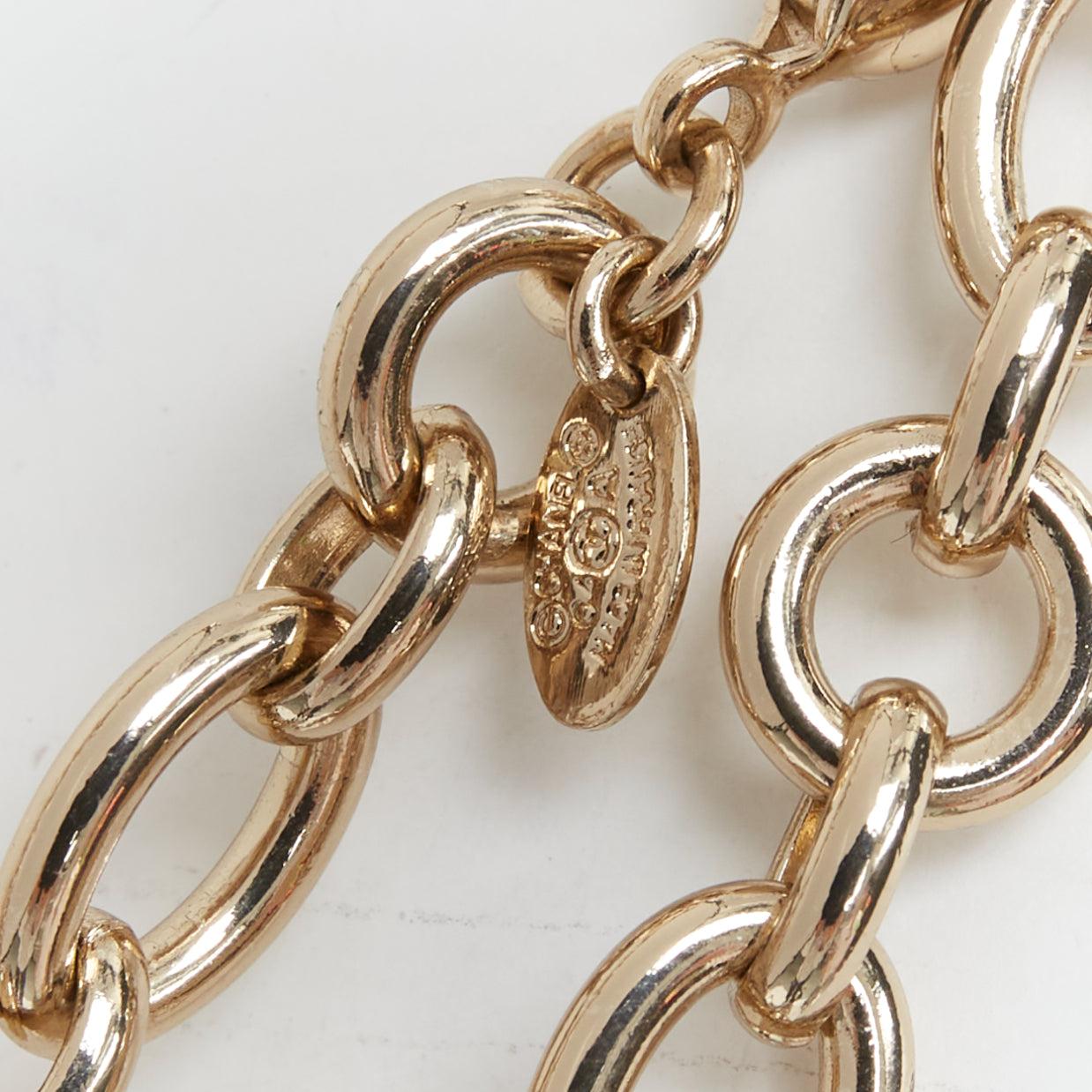 Women's CHANEL 04A gold tone CC logo pearl globe charm chain belt necklace For Sale