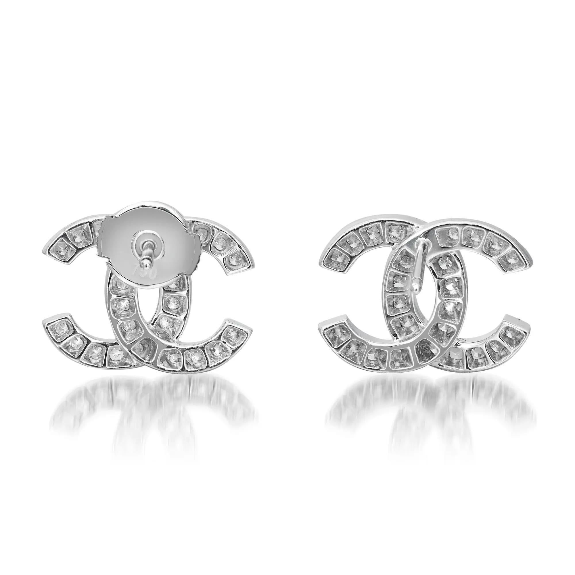 These stunning Chanel Double C earrings crafted in 18K white gold and encrusted with approx. 0.56 carat of bright white dazzling round brilliant cut diamonds. The earrings measure 14.6mm x 10.9mm. Signed Chanel, 750. Excellent preowned condition.
