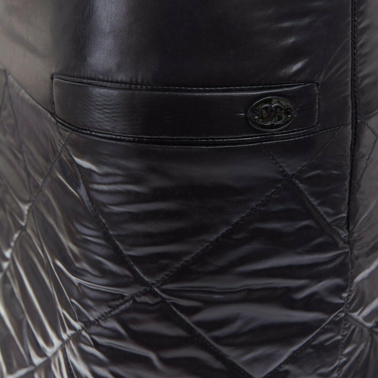 CHANEL 06A black quilted nylon dual pocket CC charm mini skirt FR34 XS

CHANEL
FROM THE 2006 COLLECTION
Black nylon. 
Tonal diamond quilting. 
Dual front pockets. 
Tonal CC charm on pocket. 
Concealed side zip closure. 
Mini skirt.
Made in
