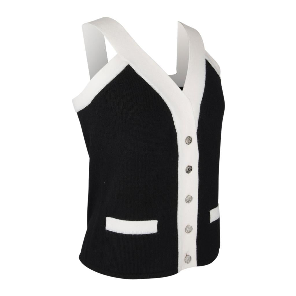 Guaranteed authentic Chanel 06A sleeveless top.  
Black V-neck button down sleeveless 'Spectator'  top.
1 3/4