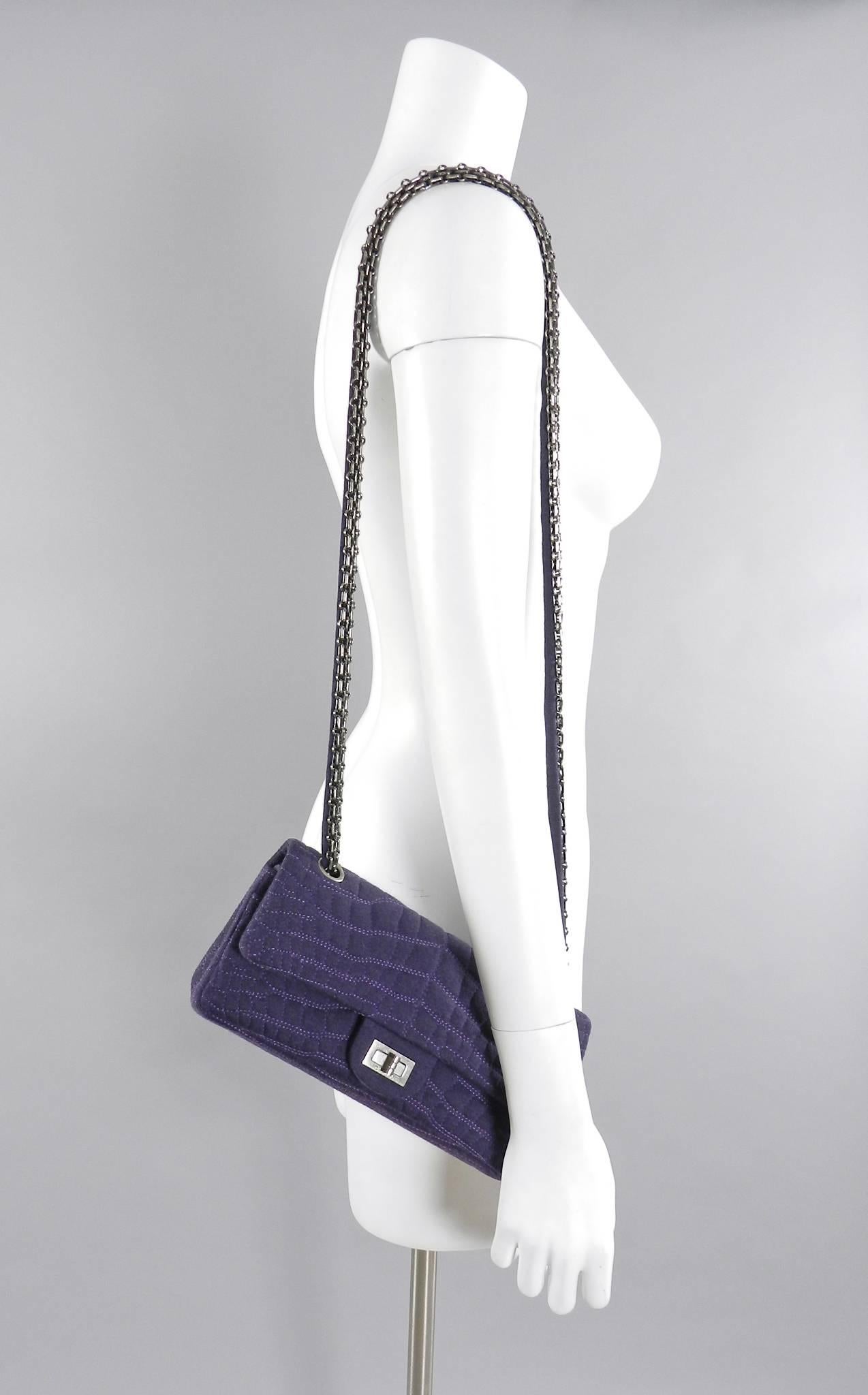 Chanel 07A Purple Knit Fabric Re-issue East West Flap Bag.  Double flap interior, gunmetal mademoiselle chain and turn clasp, quilted faux crocodile texture.  Measures 10 x 4.75 x 2.25