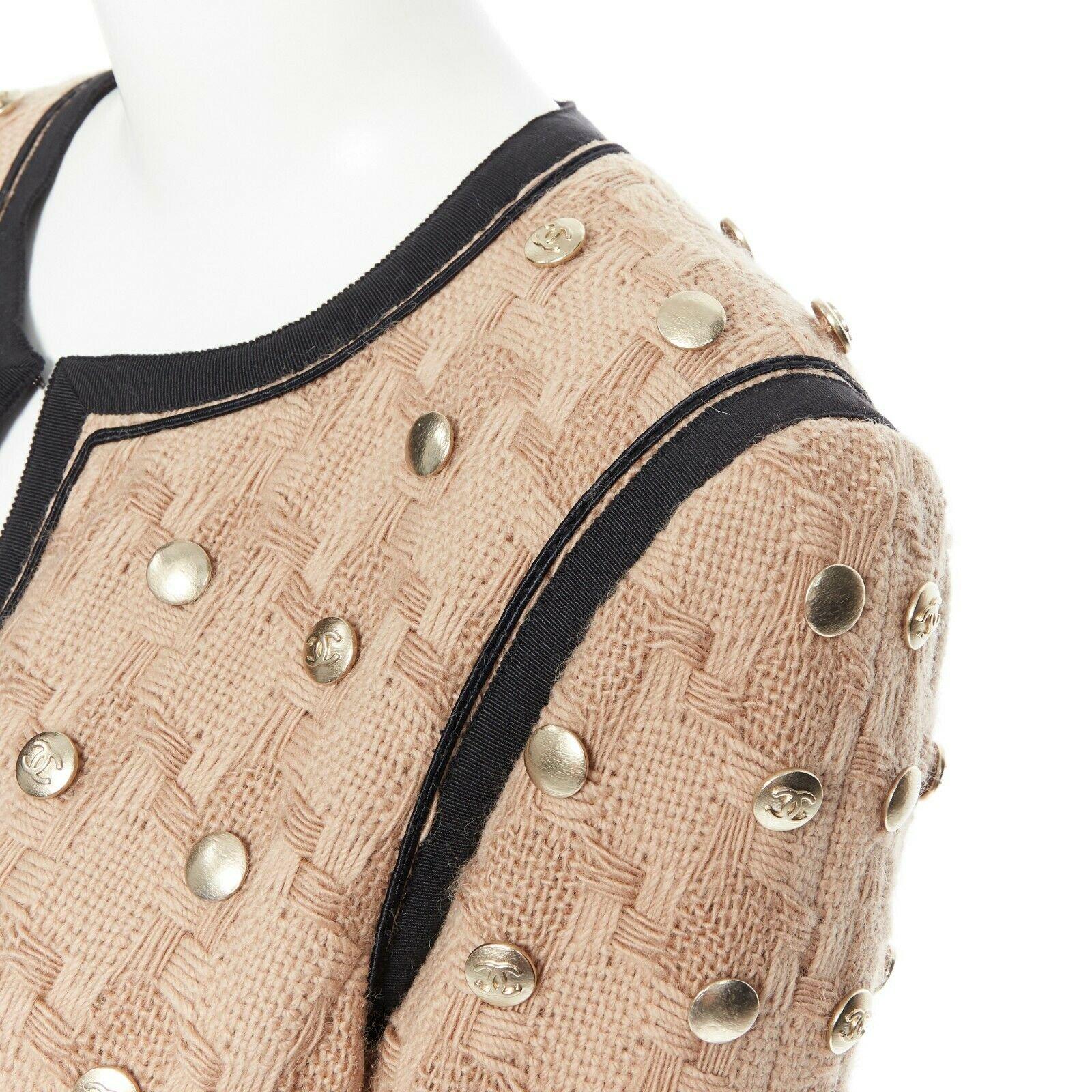 CHANEL 08A sand beige wool weave basket knit gold button embellish jacket FR44 Reference: ZING/A00100 
Brand: Chanel 
Designer: Karl Lagerfeld 
Collection: 08A 
Material: Wool 
Color: Beige 
Pattern: Solid 
Extra Detail: Basket weaved knit jacket.
