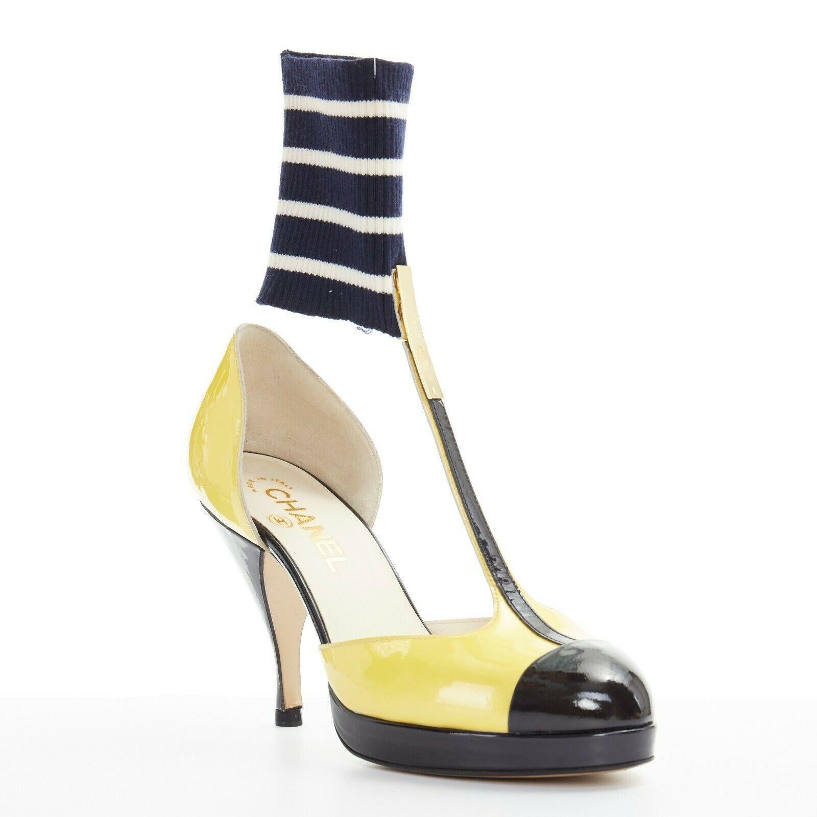 CHANEL 08C yellow black patent T-strap changeable ribbed ankle spck pump EU37

CHANEL
FROM THE 08C COLLECTION
Yellow and black patent leather upper. Black toe cap. Rounded toe. Platform sole. T-strap. Gold-tone hardware signed CHANEL at front.
