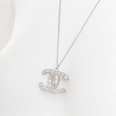 CHANEL 09A silver toned green resin reversible crystal pave CC pendent necklace